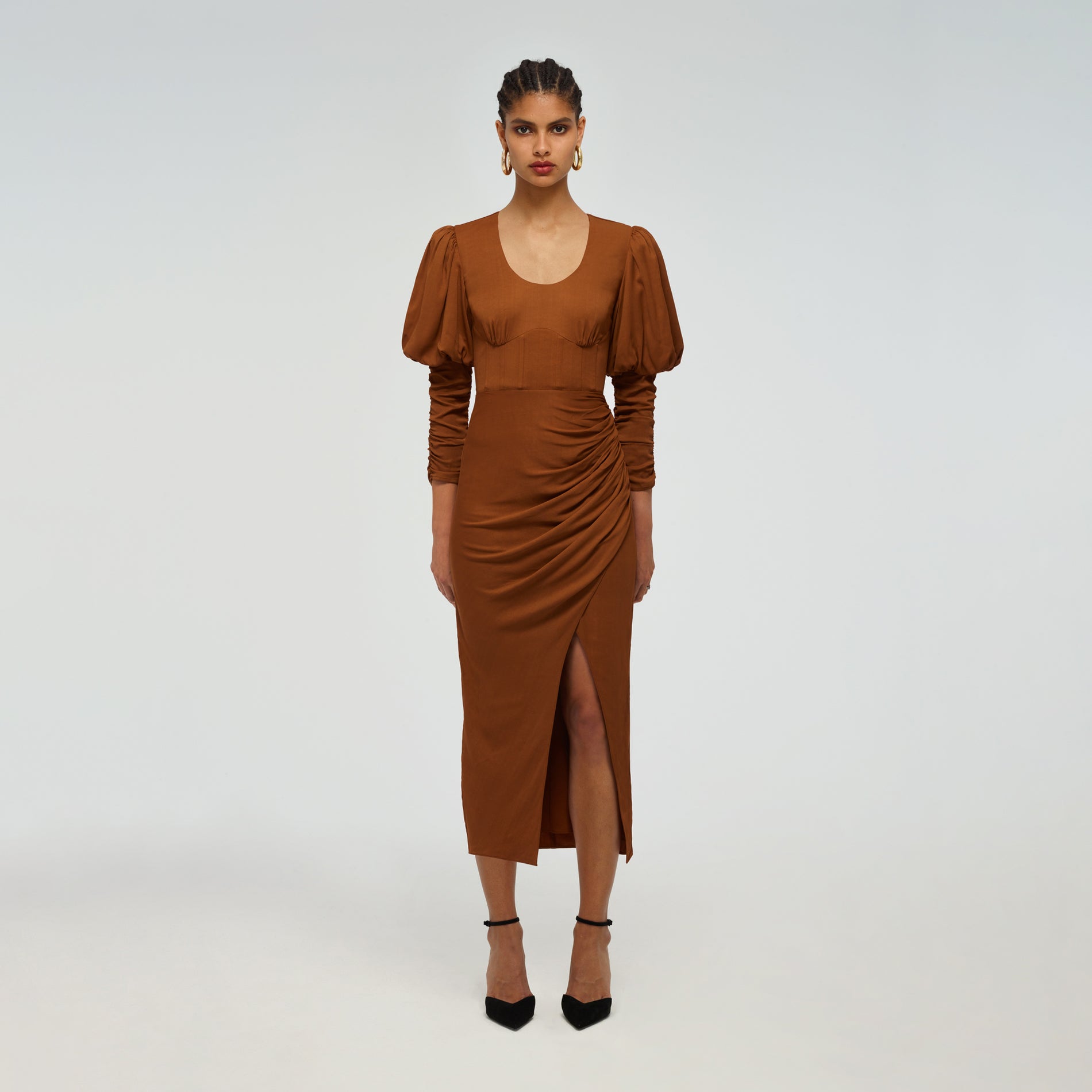 A woman wearing the Puff Sleeve Midi Dress