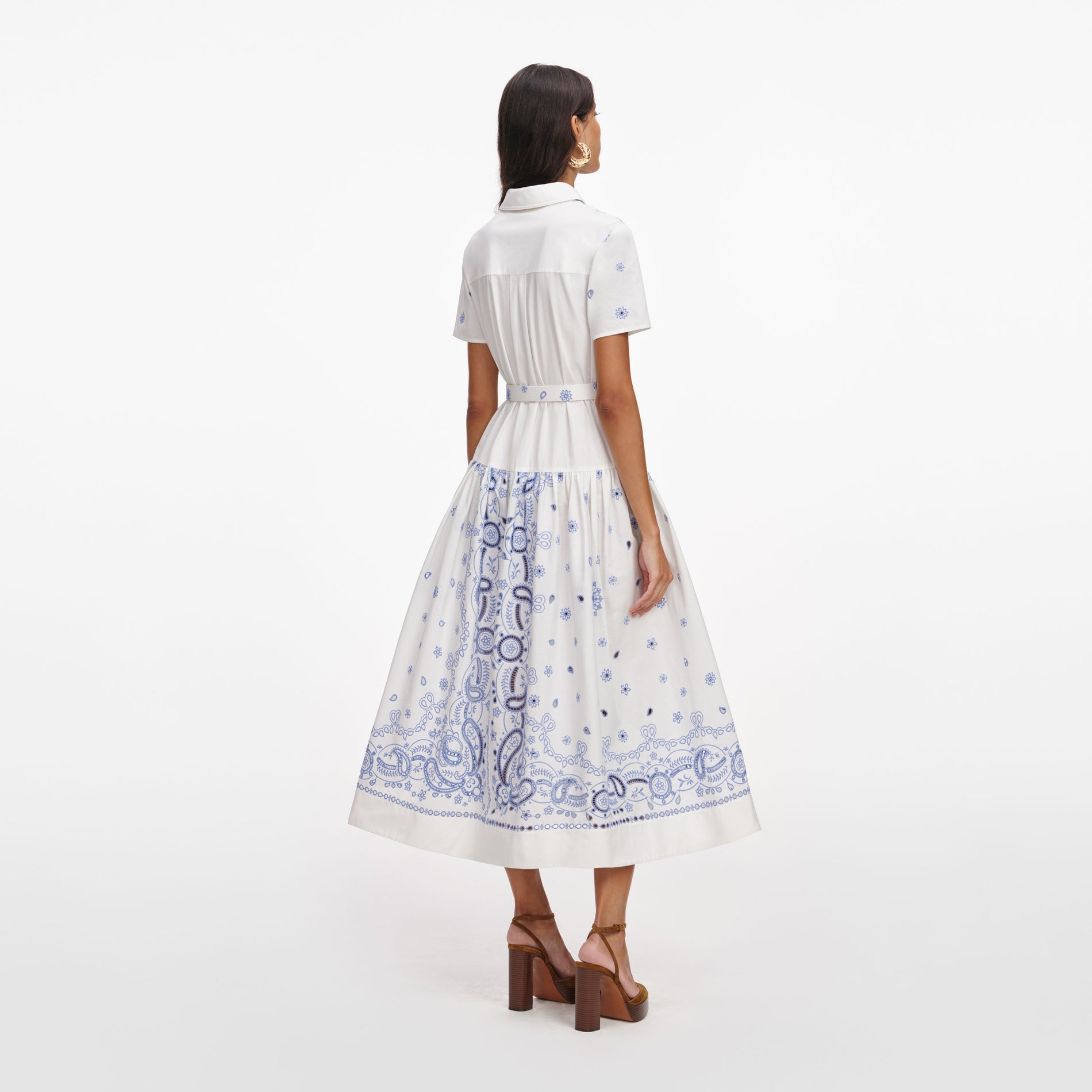 Back view of a woman wearing the White And Blue Embroidered Midi Dress