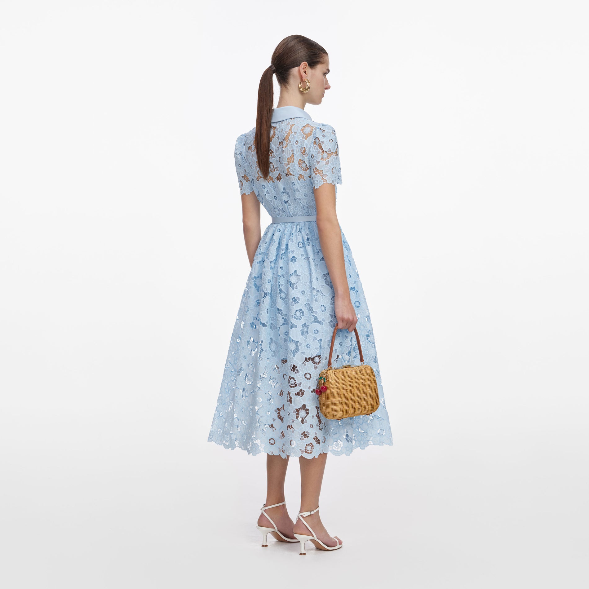 Back view of a woman wearing the Blue Lace Collared Midi Dress