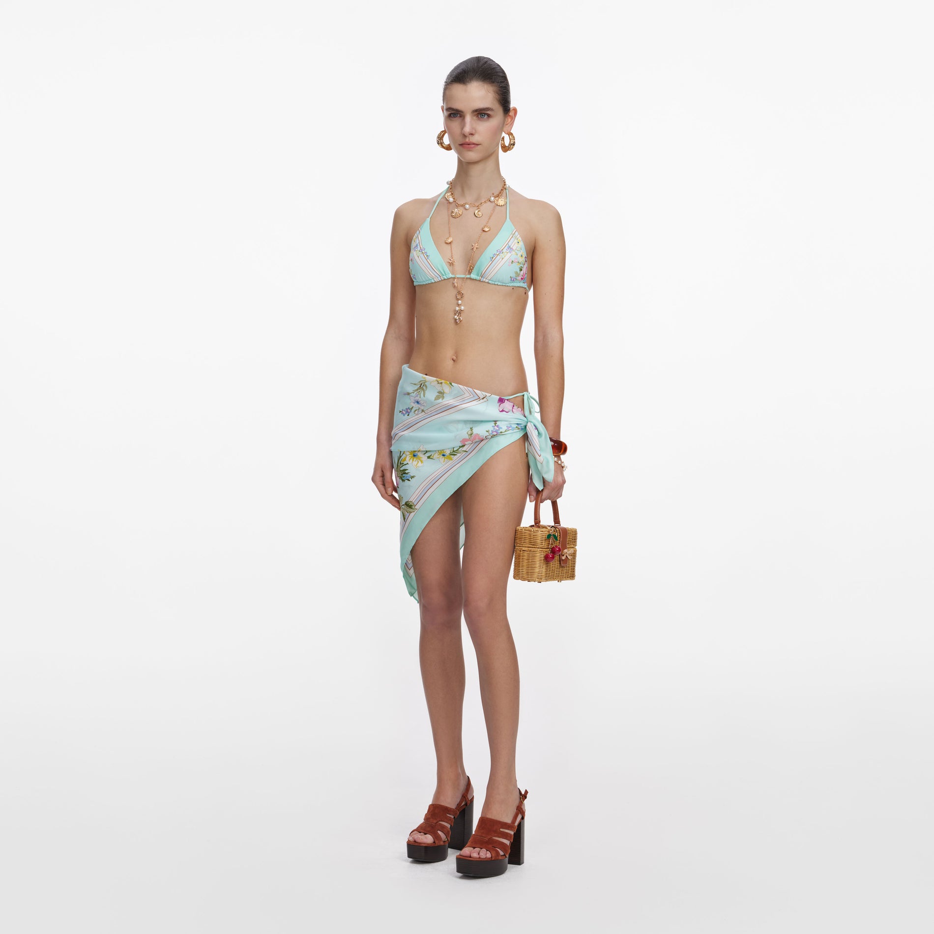 Side view of a woman wearing the Mint Floral Bikini Top