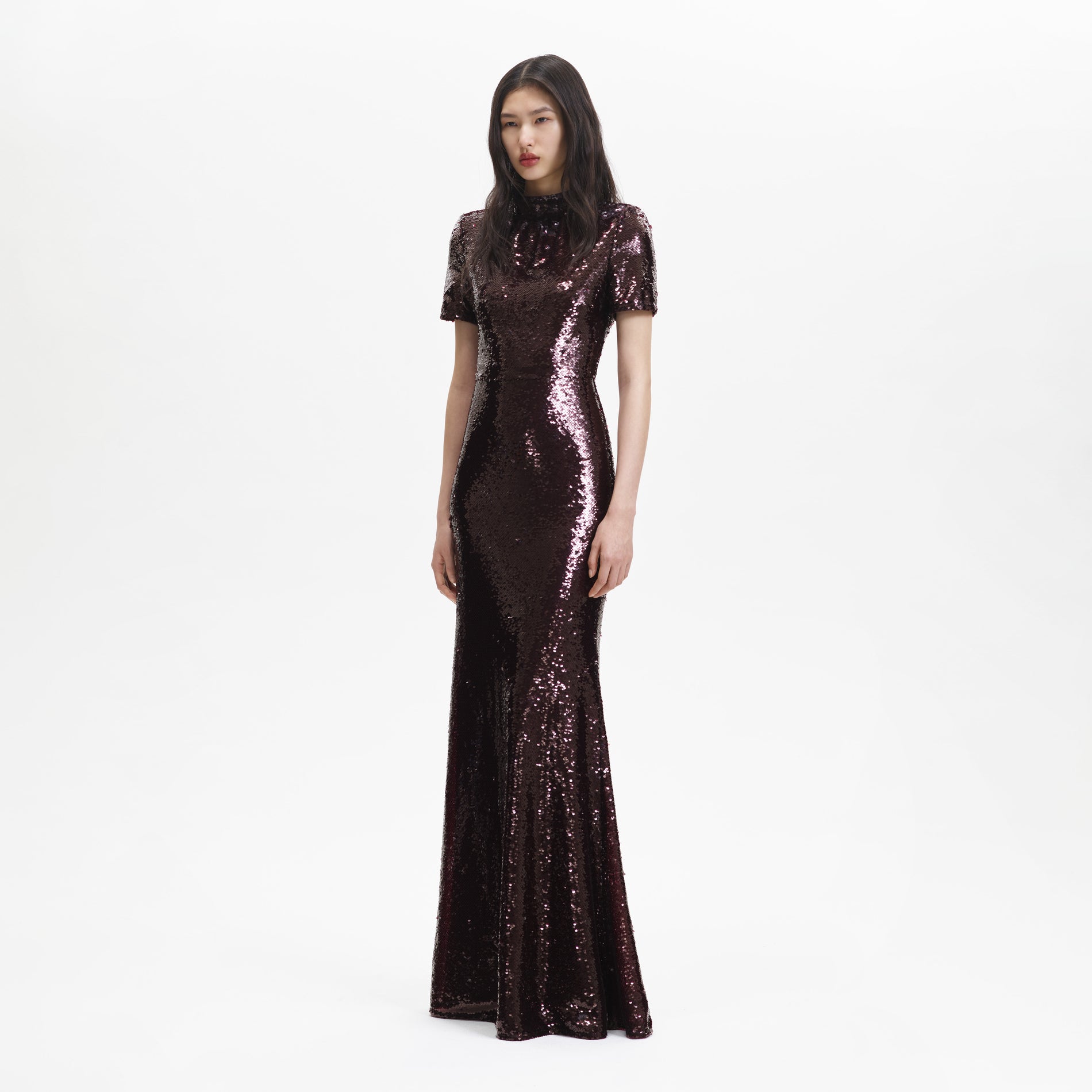 Side view of a woman wearing the Brown Sequin Maxi Dress
