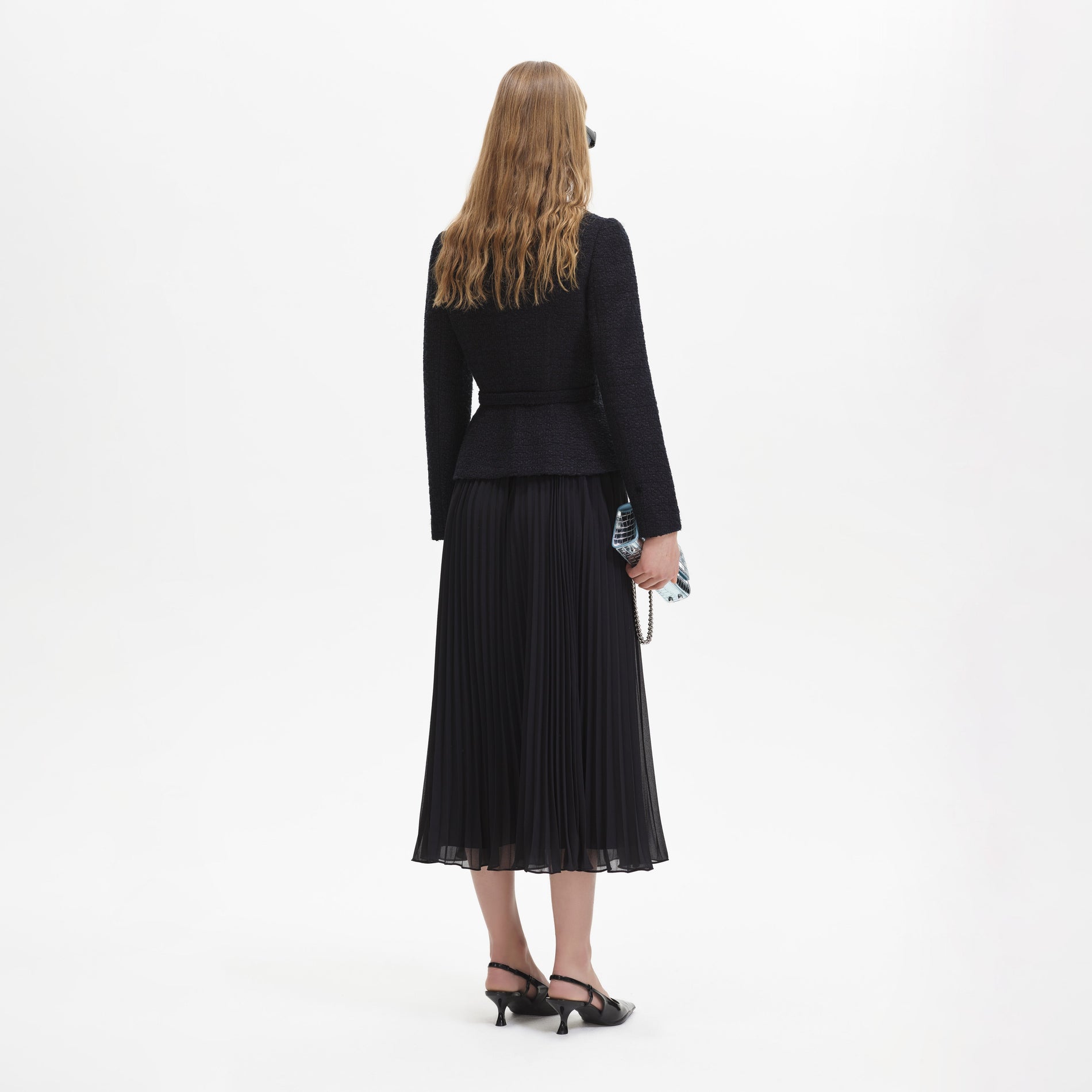 A woman wearing the Black Boucle Chiffon Midi Dress