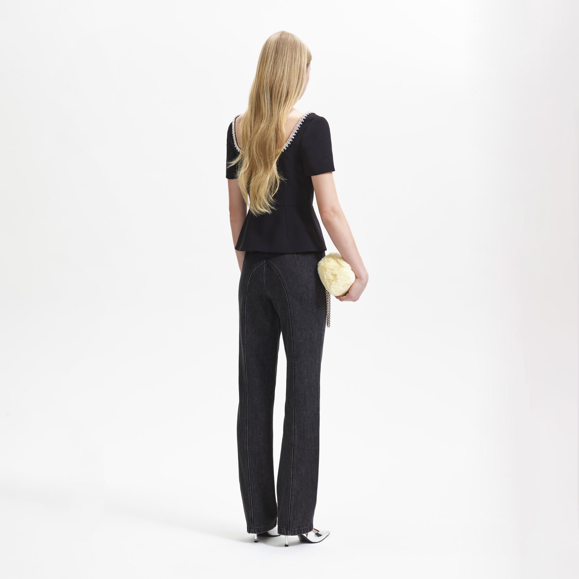 A woman wearing the Black Bonded Crepe Top