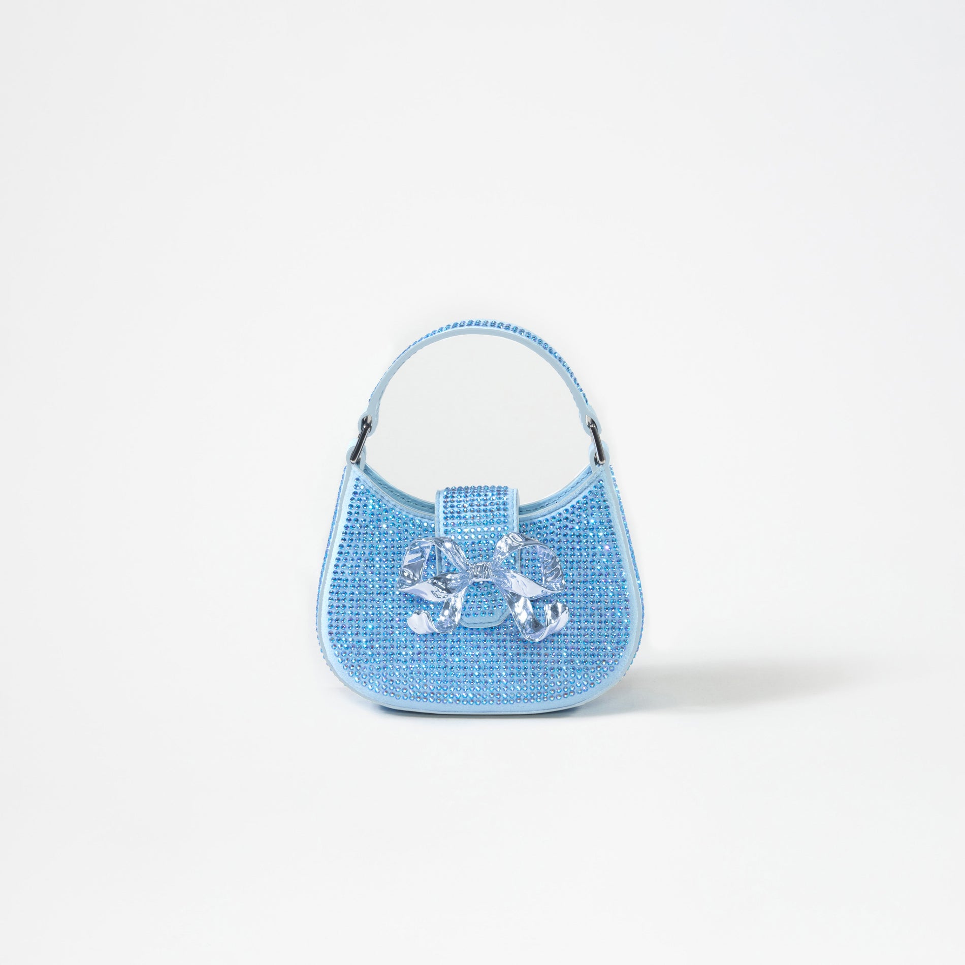 A woman wearing the Blue Rhinestone Crescent Bow Micro Bag