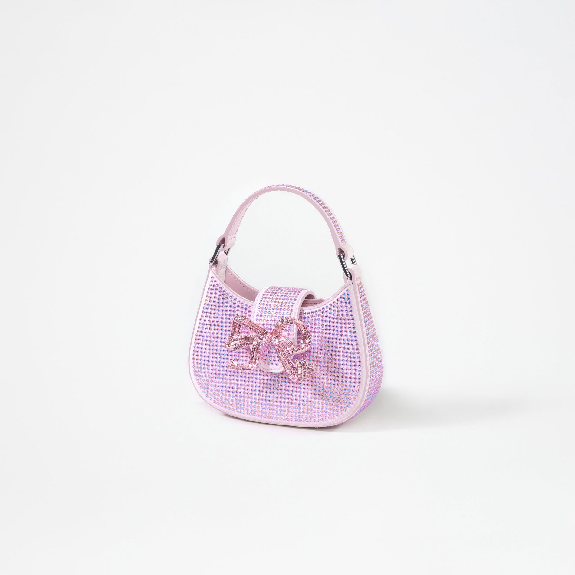 A woman wearing the Pink Rhinestone Crescent Bow Micro Bag