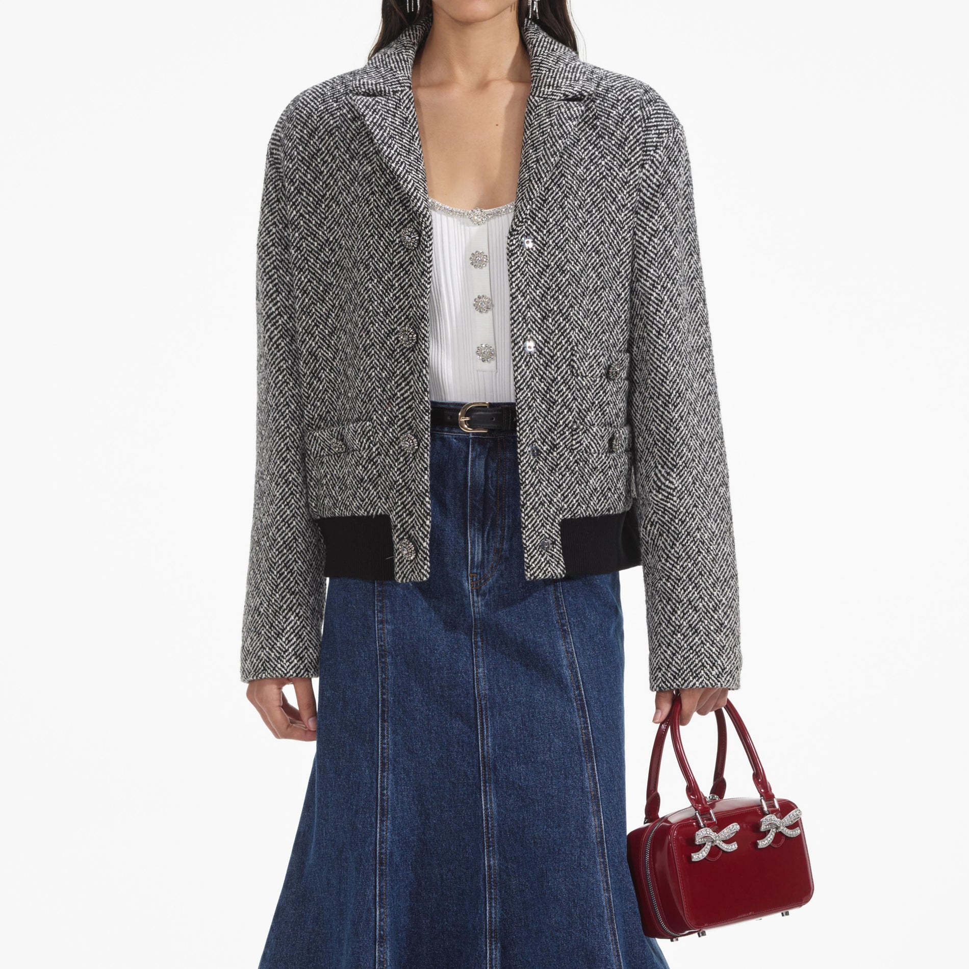 A close up of a woman wearing the Black Herringbone Bomber Jacket