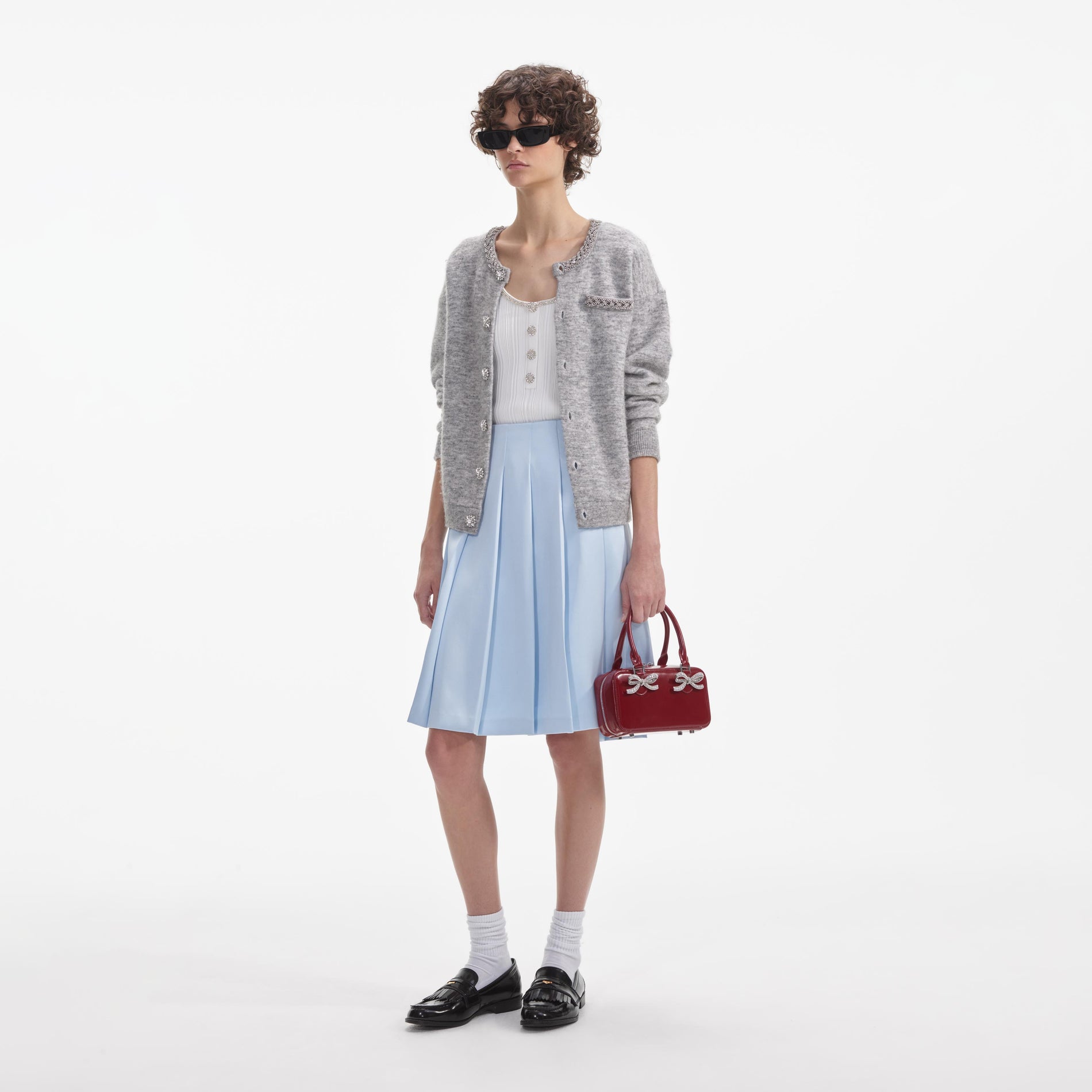 Side view of a woman wearing the Grey Melange Cardigan