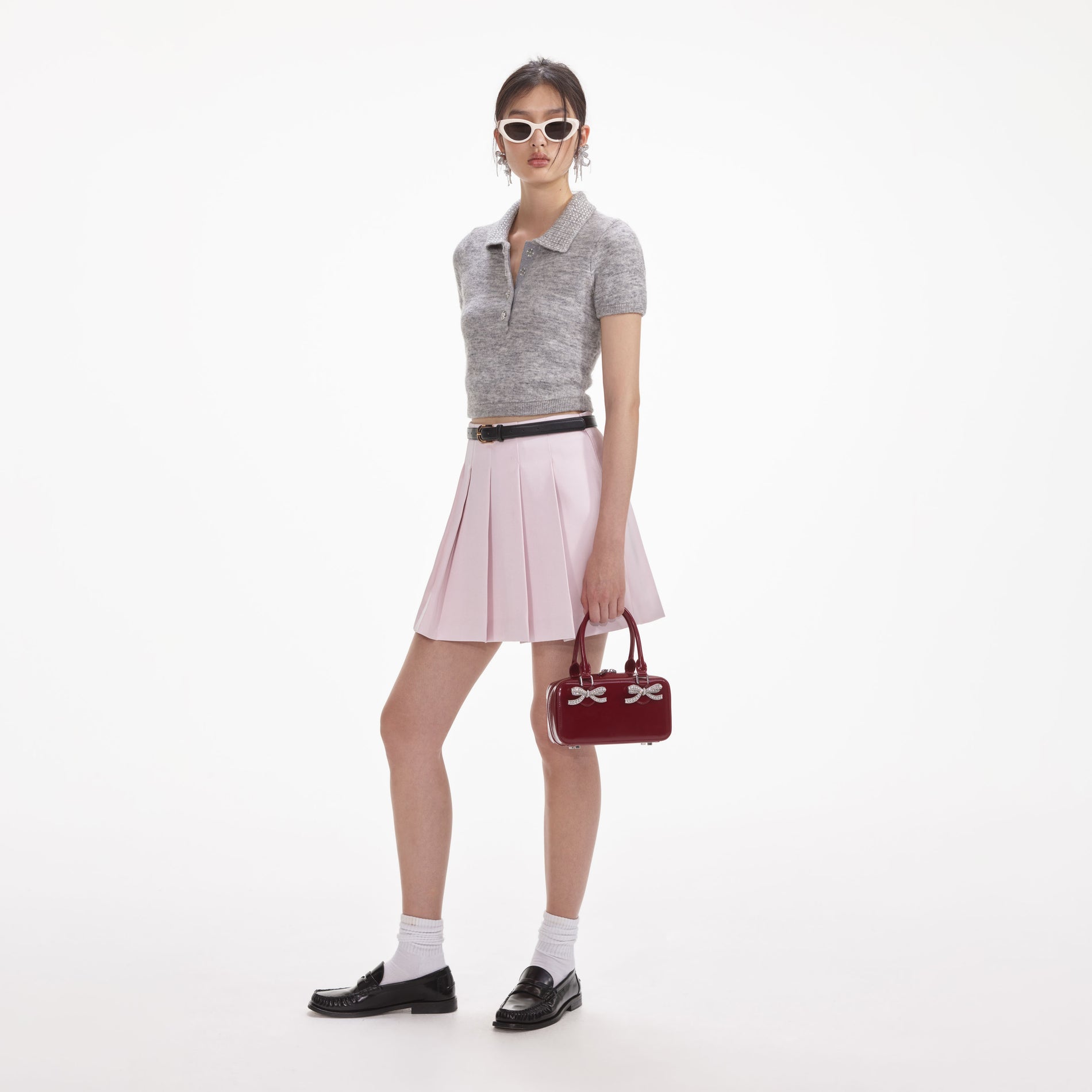 Side view of a woman wearing the Grey Melange Diamante Knit Top