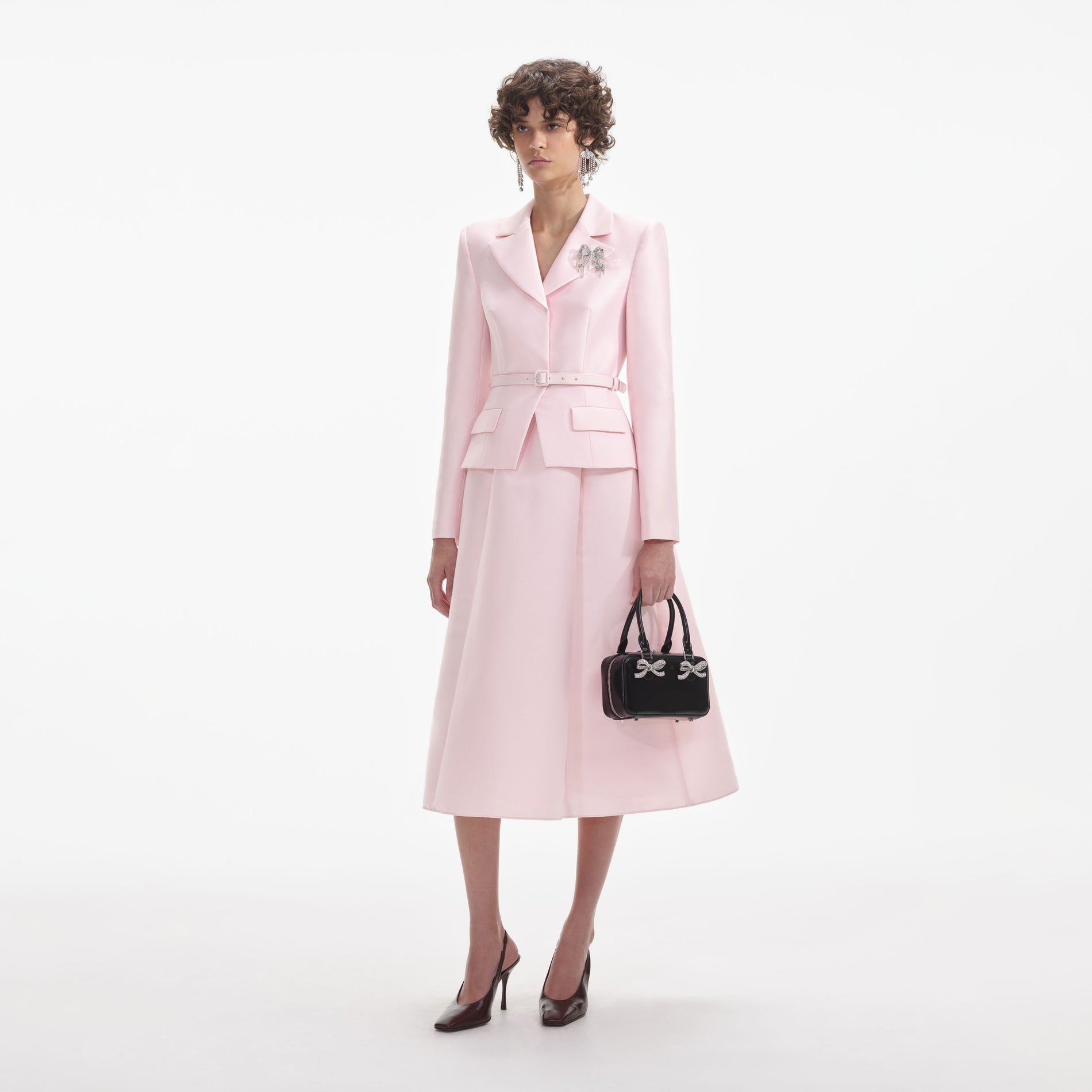 Side view of a woman wearing the Pink Tailored Taffeta Midi Dress