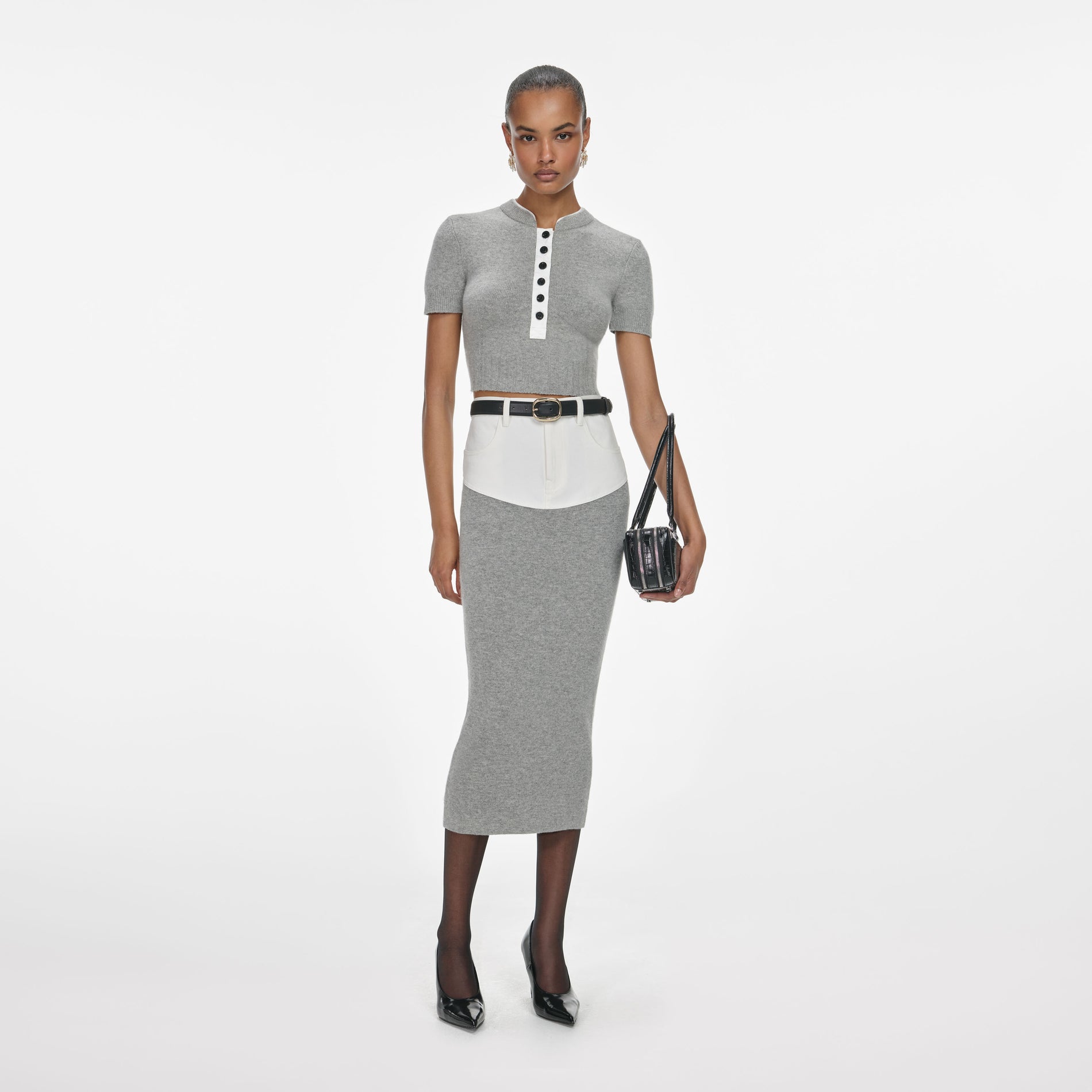 Front view of a woman wearing the Grey Knit Denim Insert Midi Skirt
