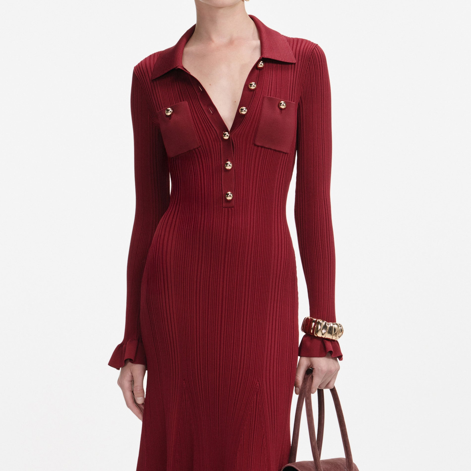 A close up of a woman wearing the Burgundy Ribbed Knit Midi Dress