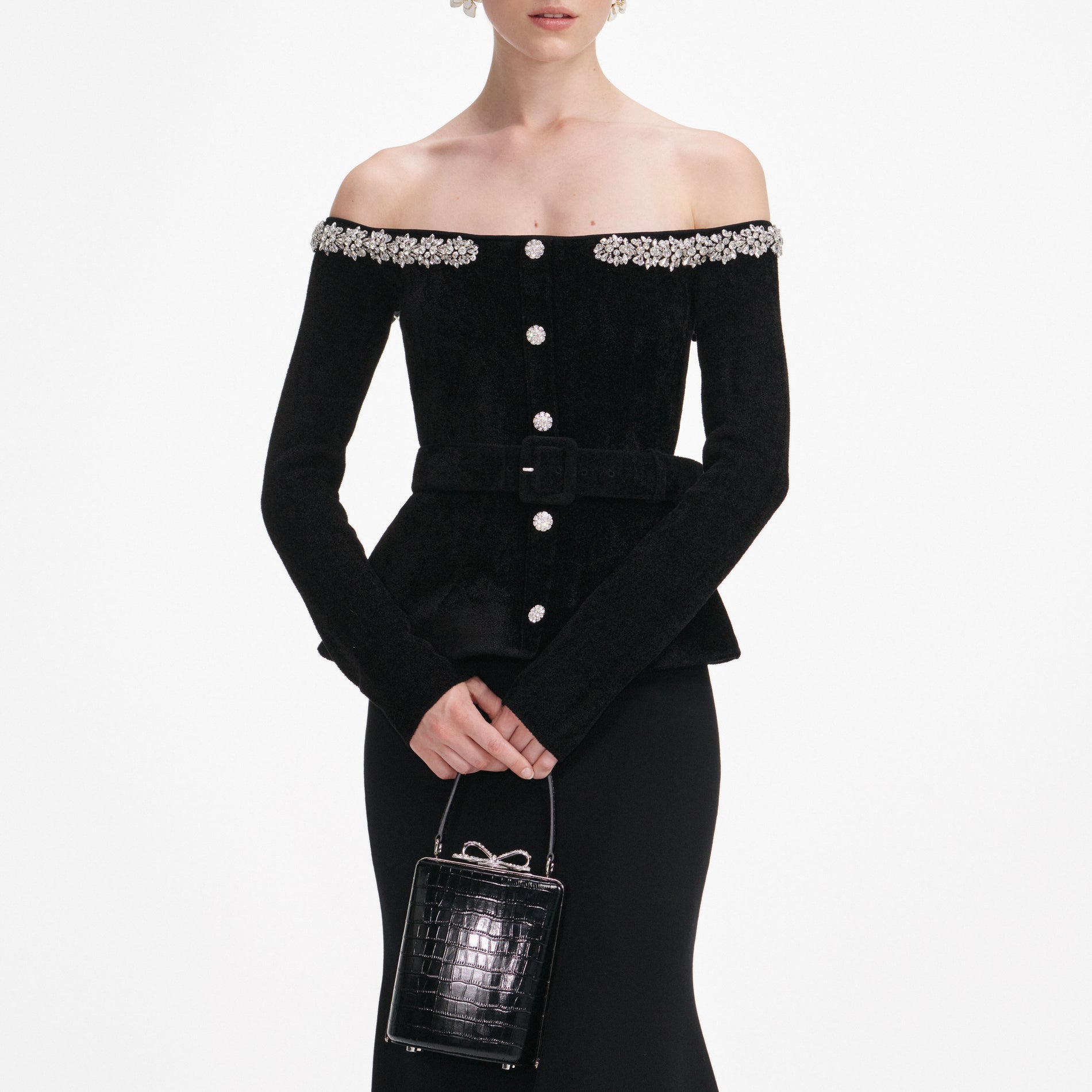 A close up of a woman wearing the Black Chenille Knit Crystal Trim Midi Dress