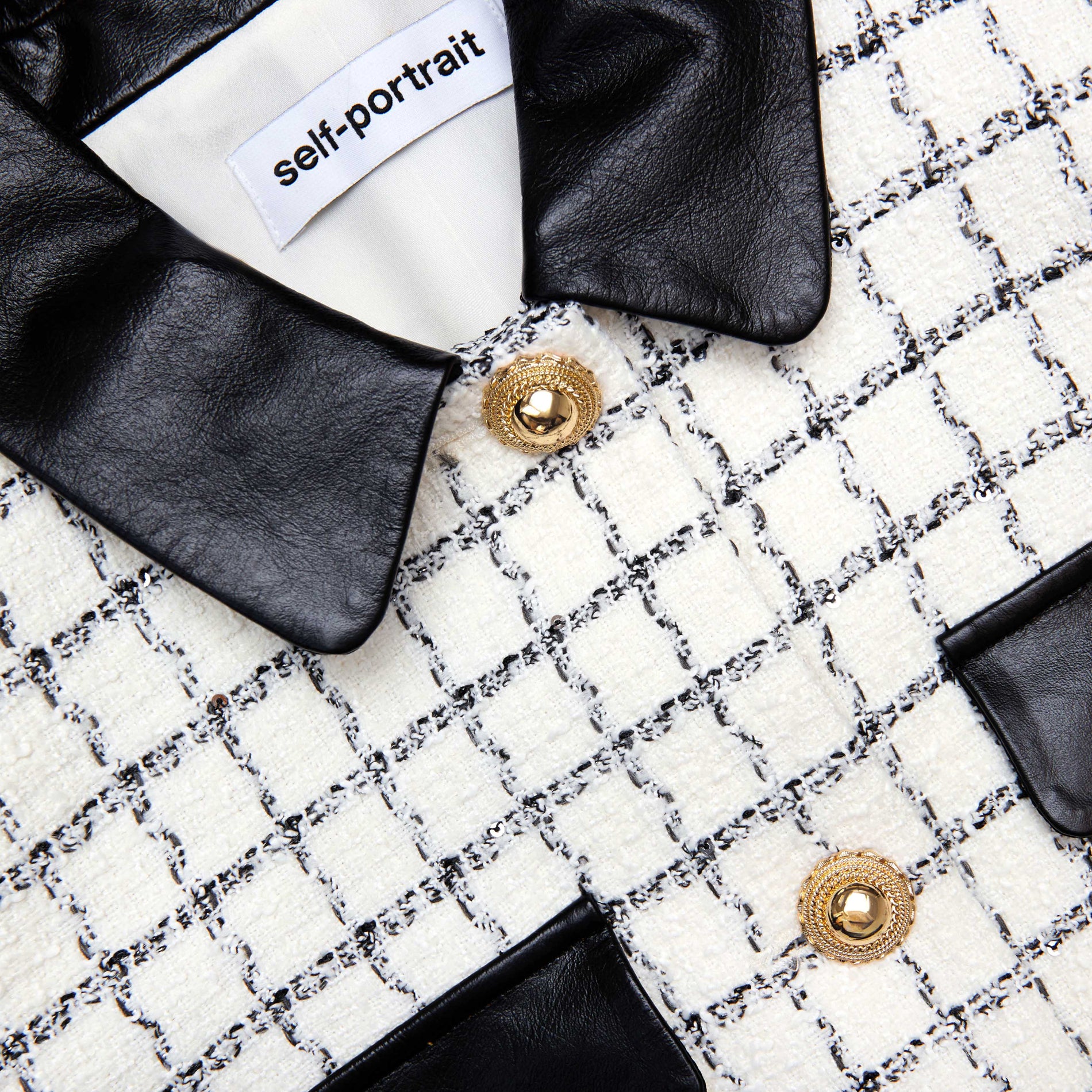 A close up of the fabric for the Check Boucle Fur Cuff Jacket