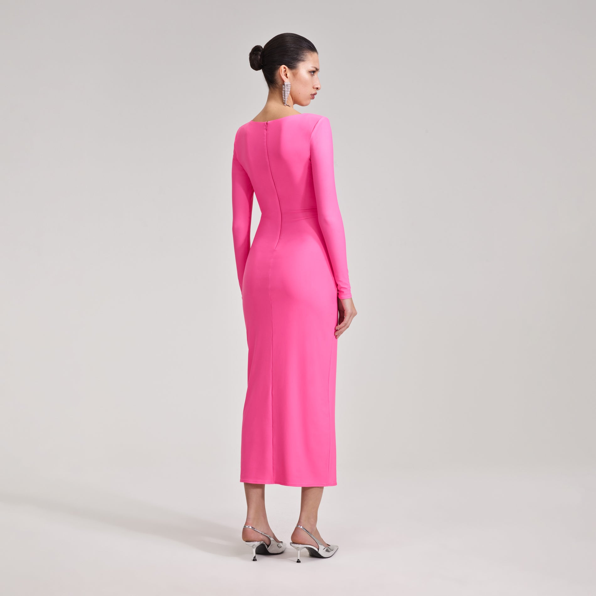 A woman wearing the Pink Jersey Midi Dress