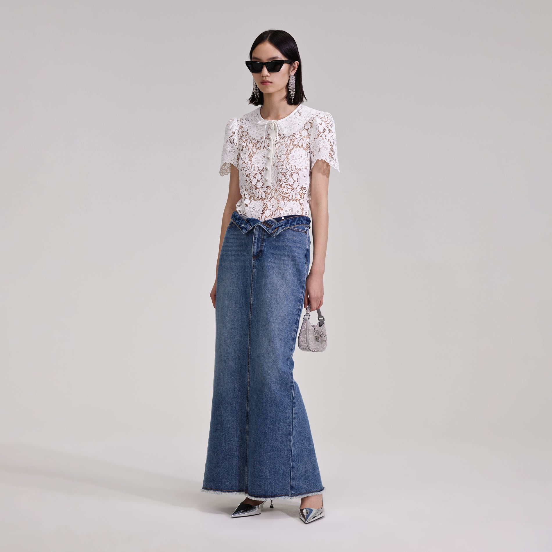 A woman wearing the White Cord Lace Top