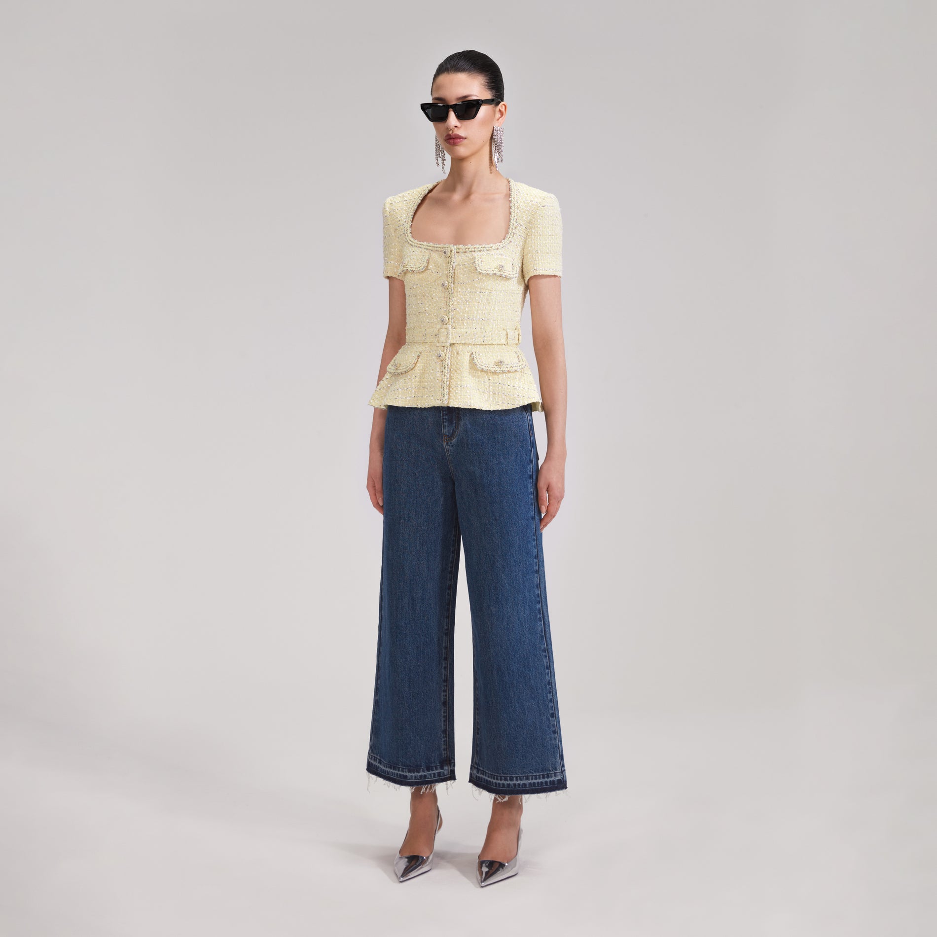 A woman wearing the Yellow Boucle Top