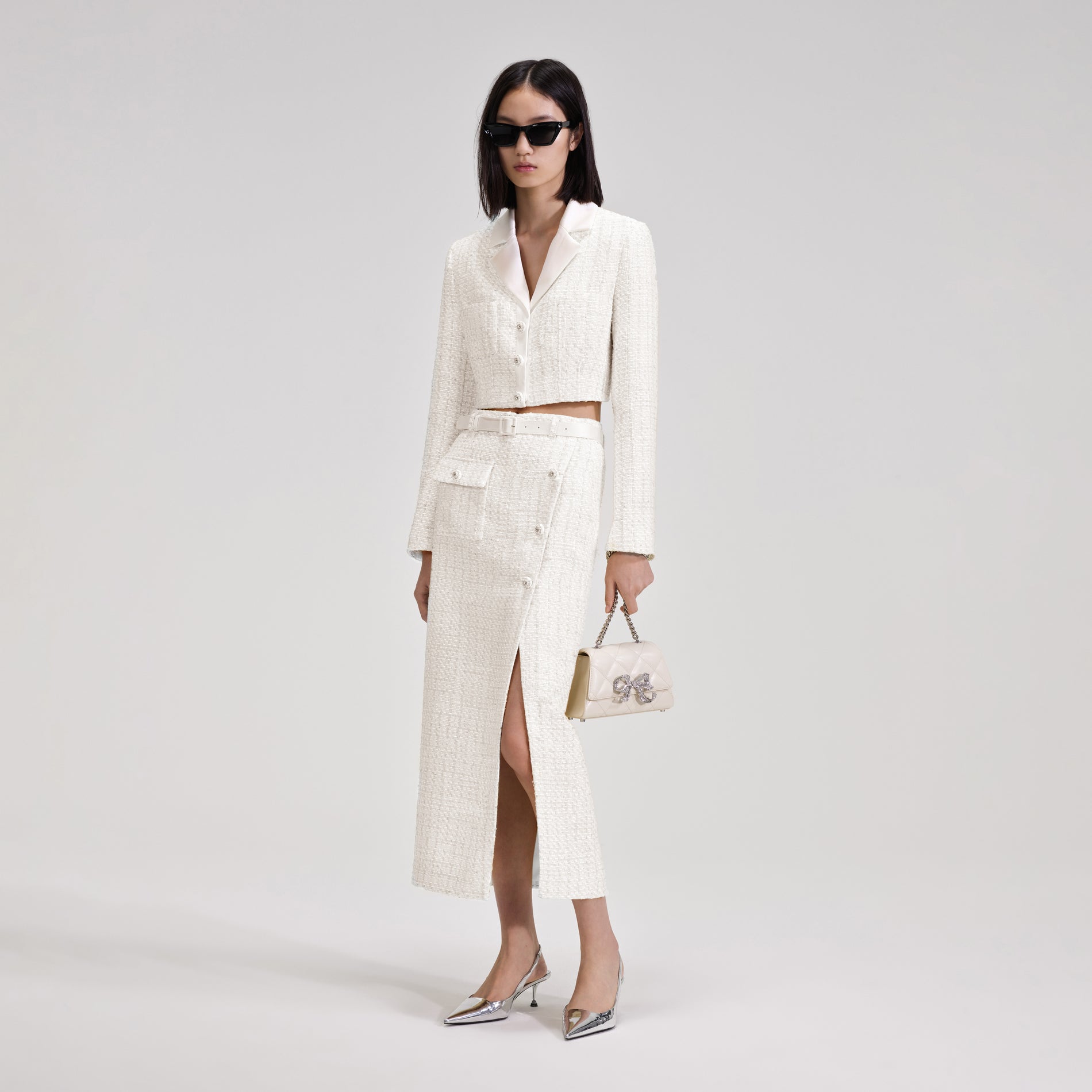 A woman wearing the White Boucle Crop Jacket