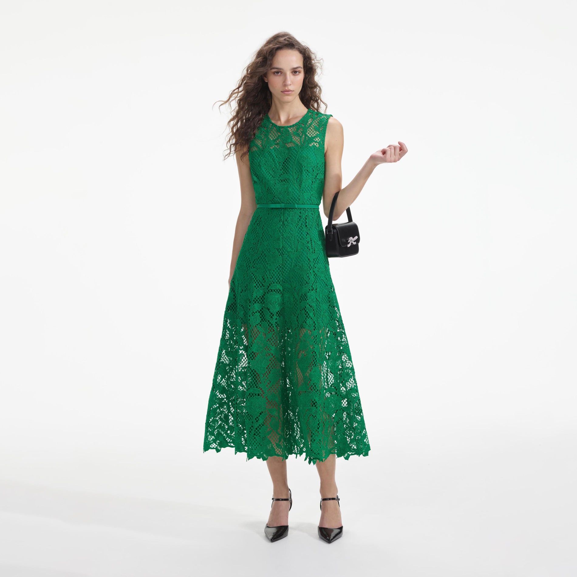 Front view of a woman wearing the Green Lace Sleeveless Midi Dress