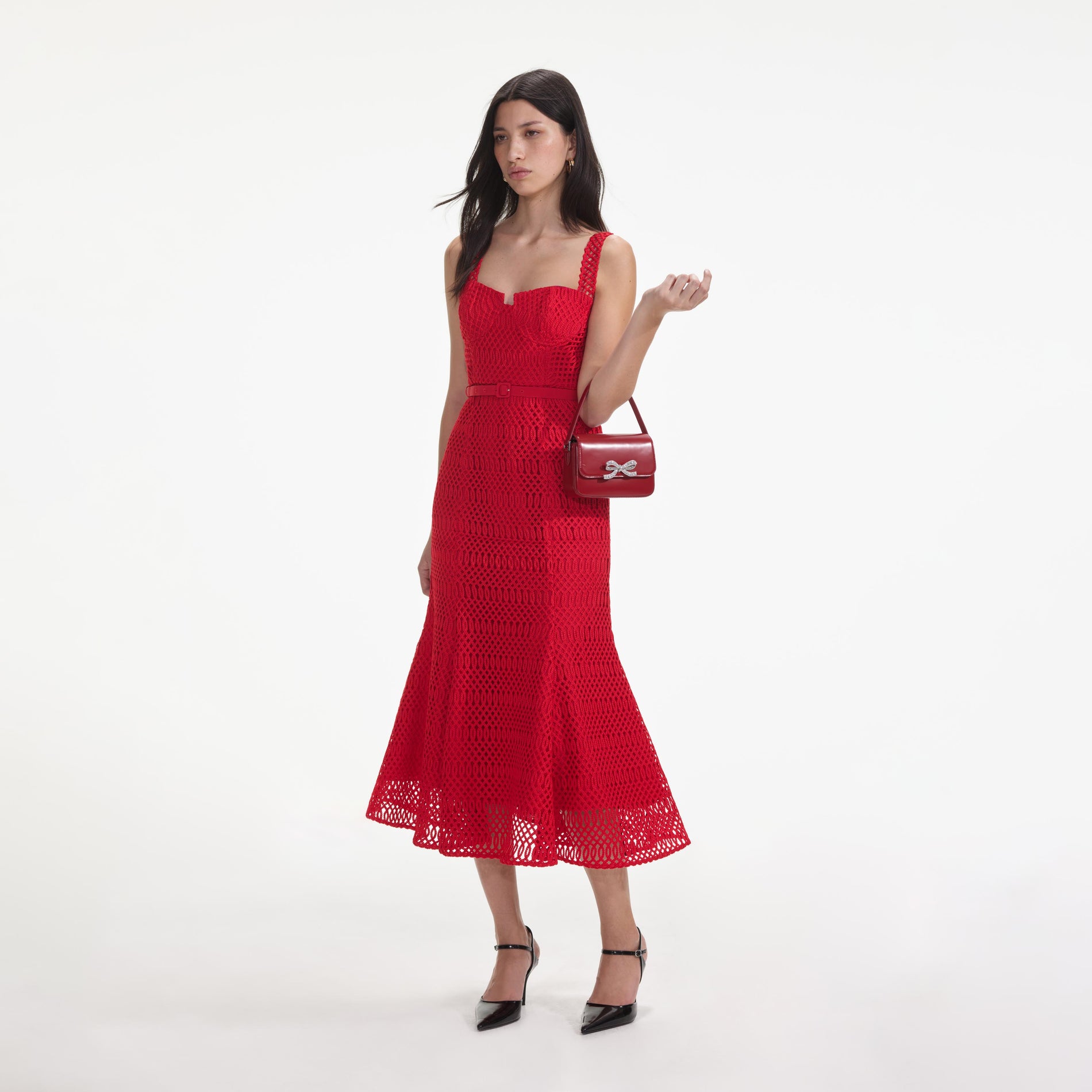 Side view of a woman wearing the Red Lattice Lace Midi Dress