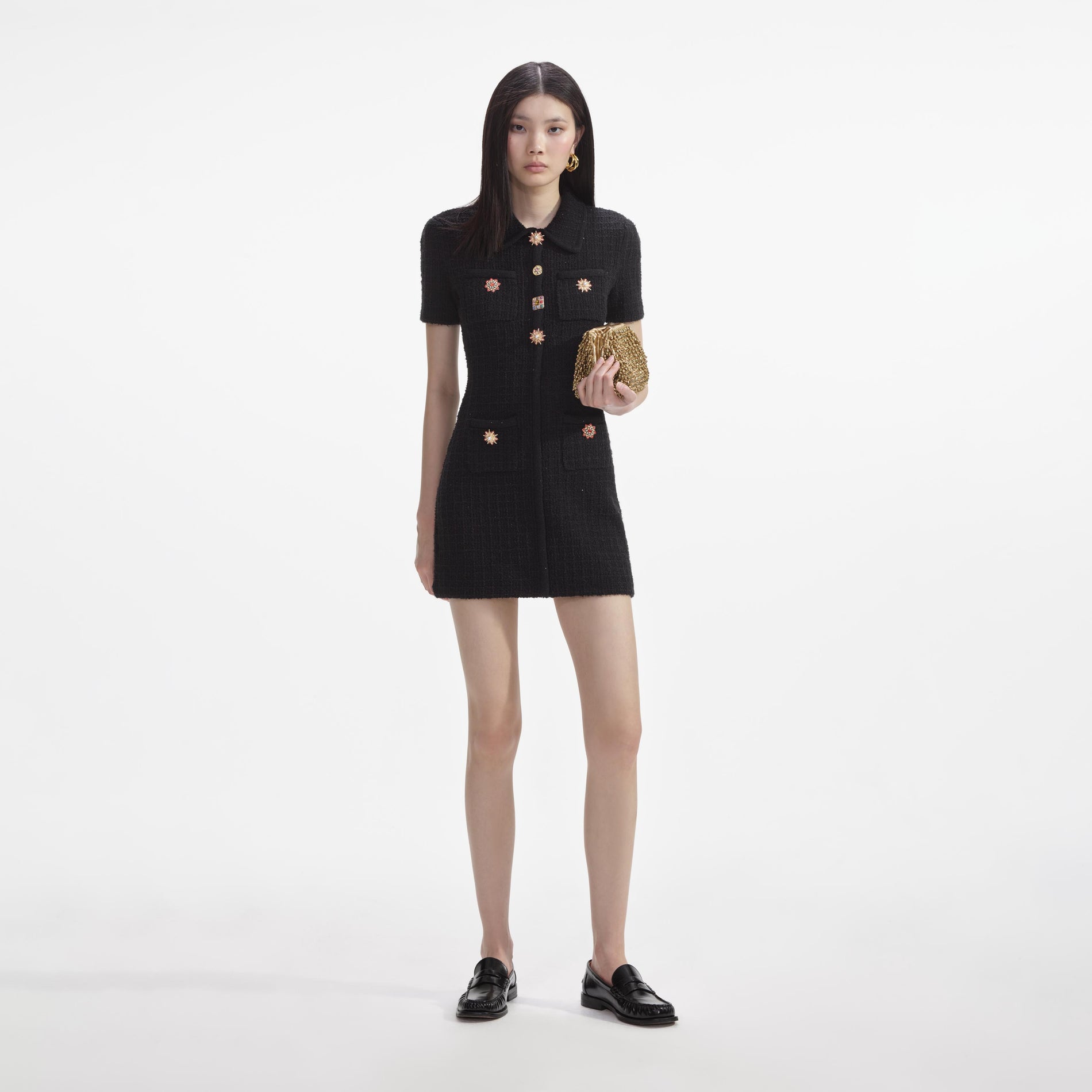 Front view of a woman wearing the Black Jewel Button Knit Mini Dress