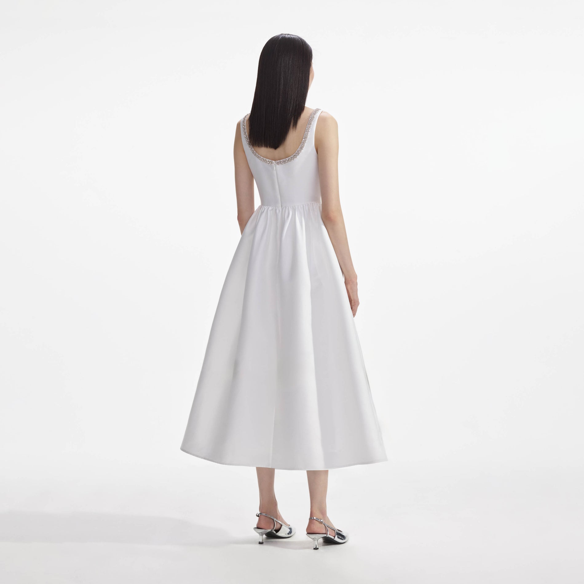 Back view of a woman wearing the White Taffeta Diamante Midi Dress