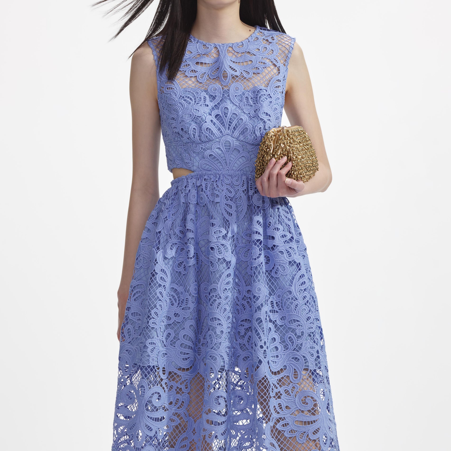 A close up of a woman wearing the Blue Lace Cut Out Midi Dress