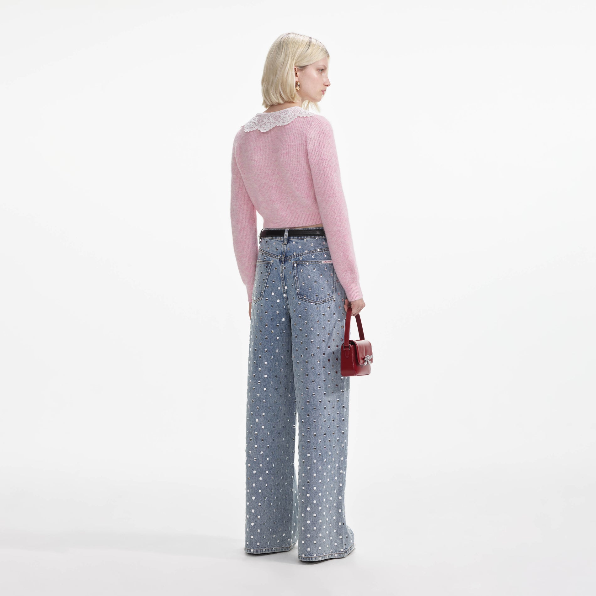 Back view of a woman wearing the Pink Fluffy Rib Knit Cardigan