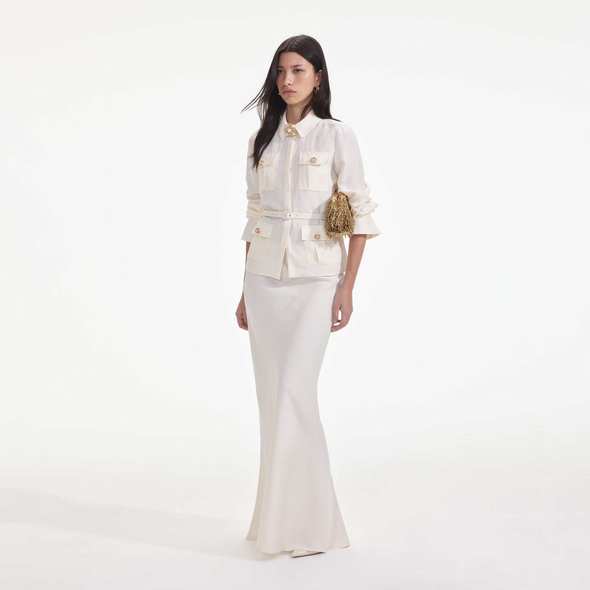 Side view of a woman wearing the Cream Linen Maxi Dress