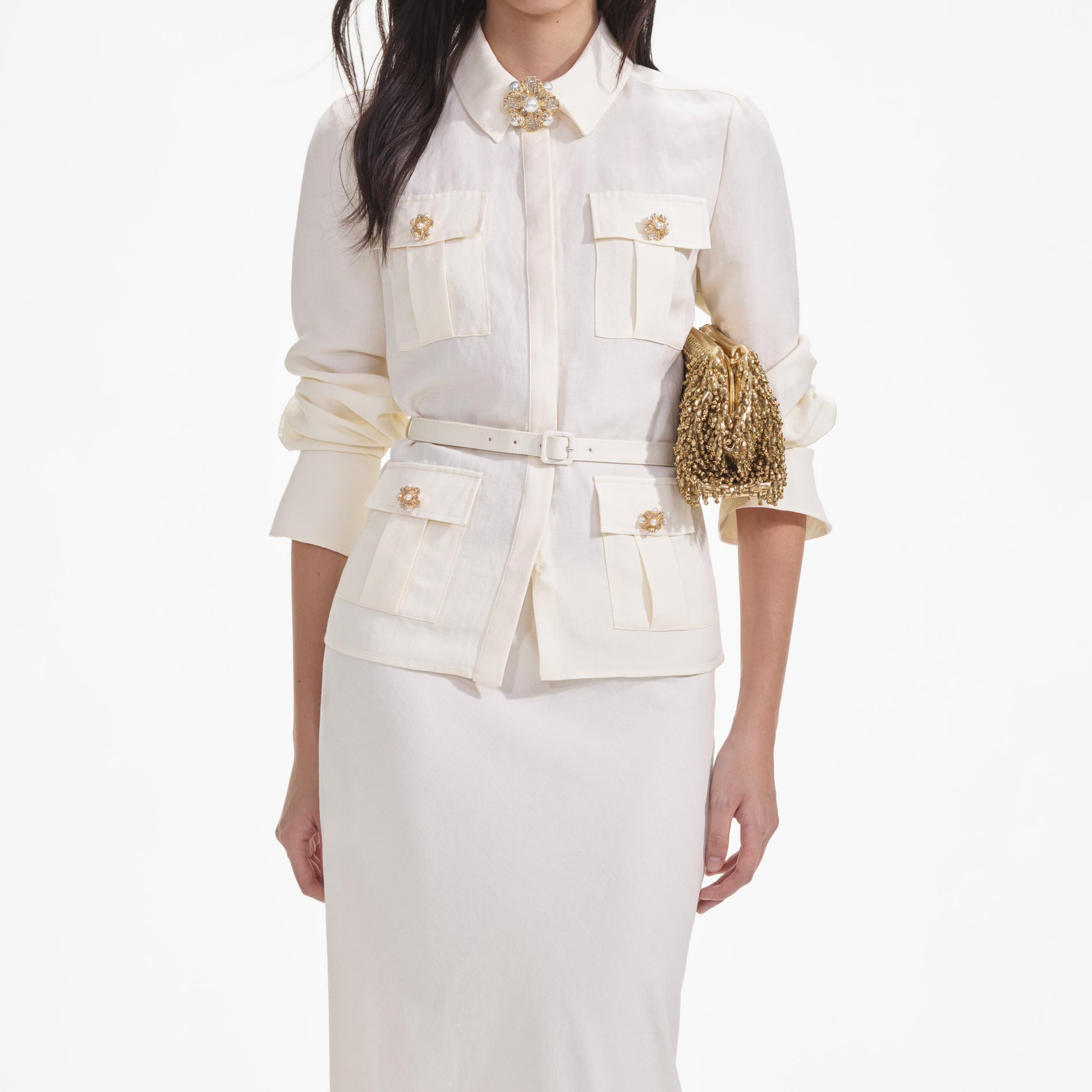 A close up of a woman wearing the Cream Linen Maxi Dress