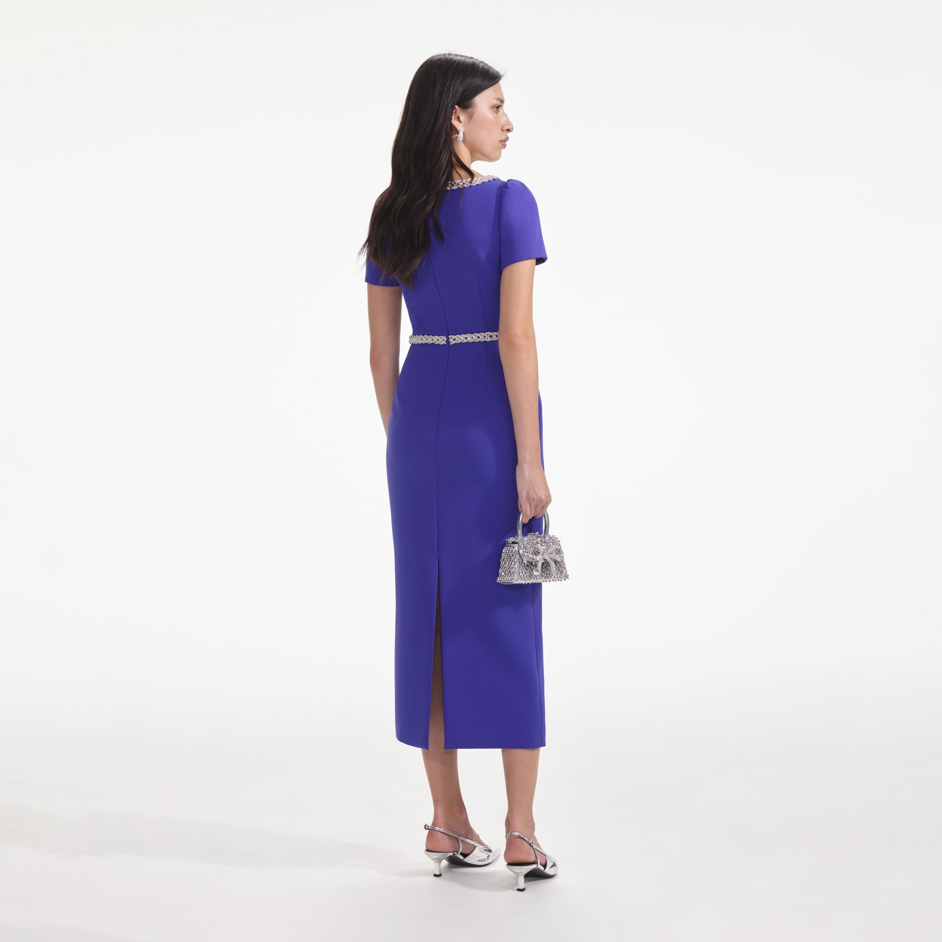 Back view of a woman wearing the Blue Diamante Bow Trim Midi Dress