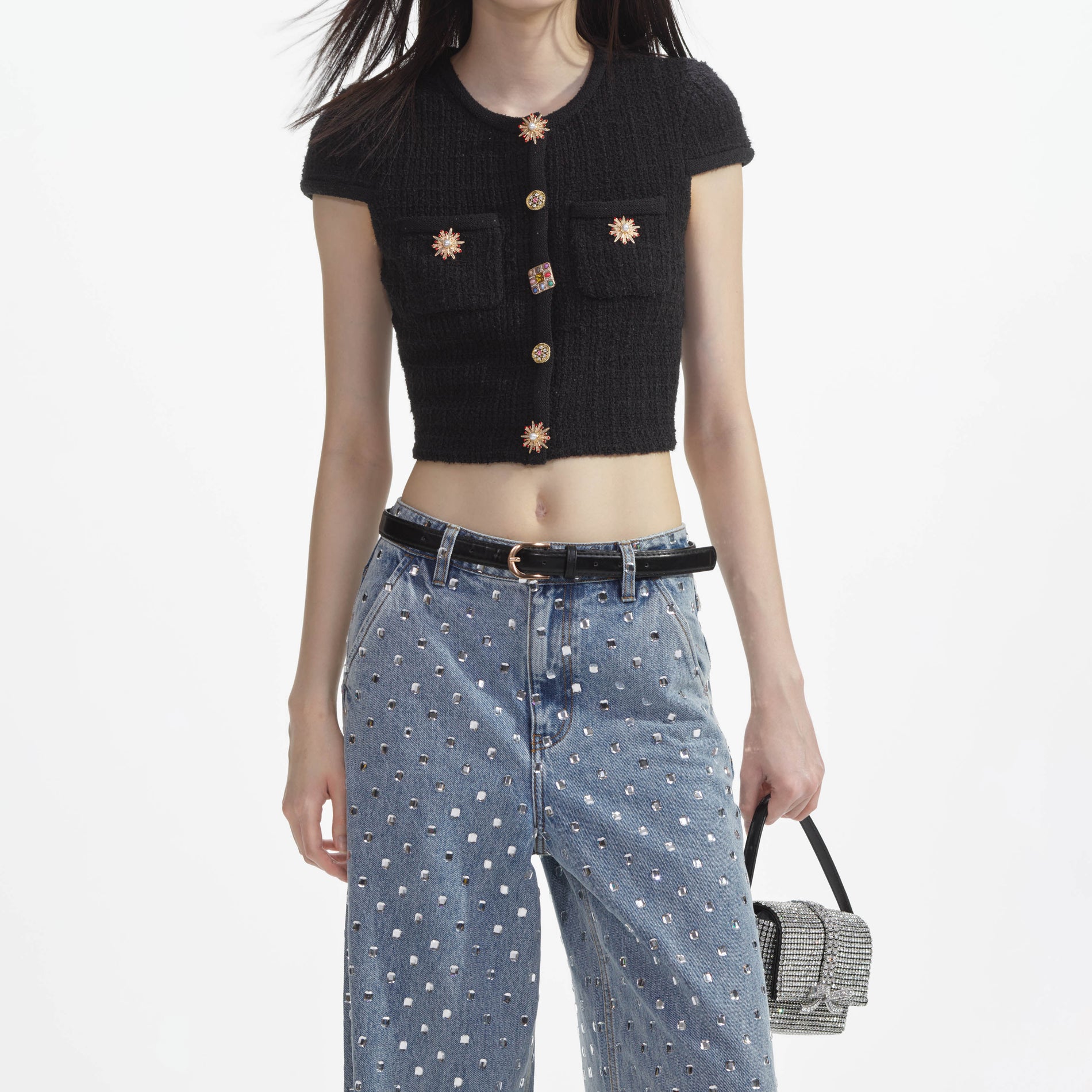 A close up of a woman wearing the Square Rhinestone Denim Jeans