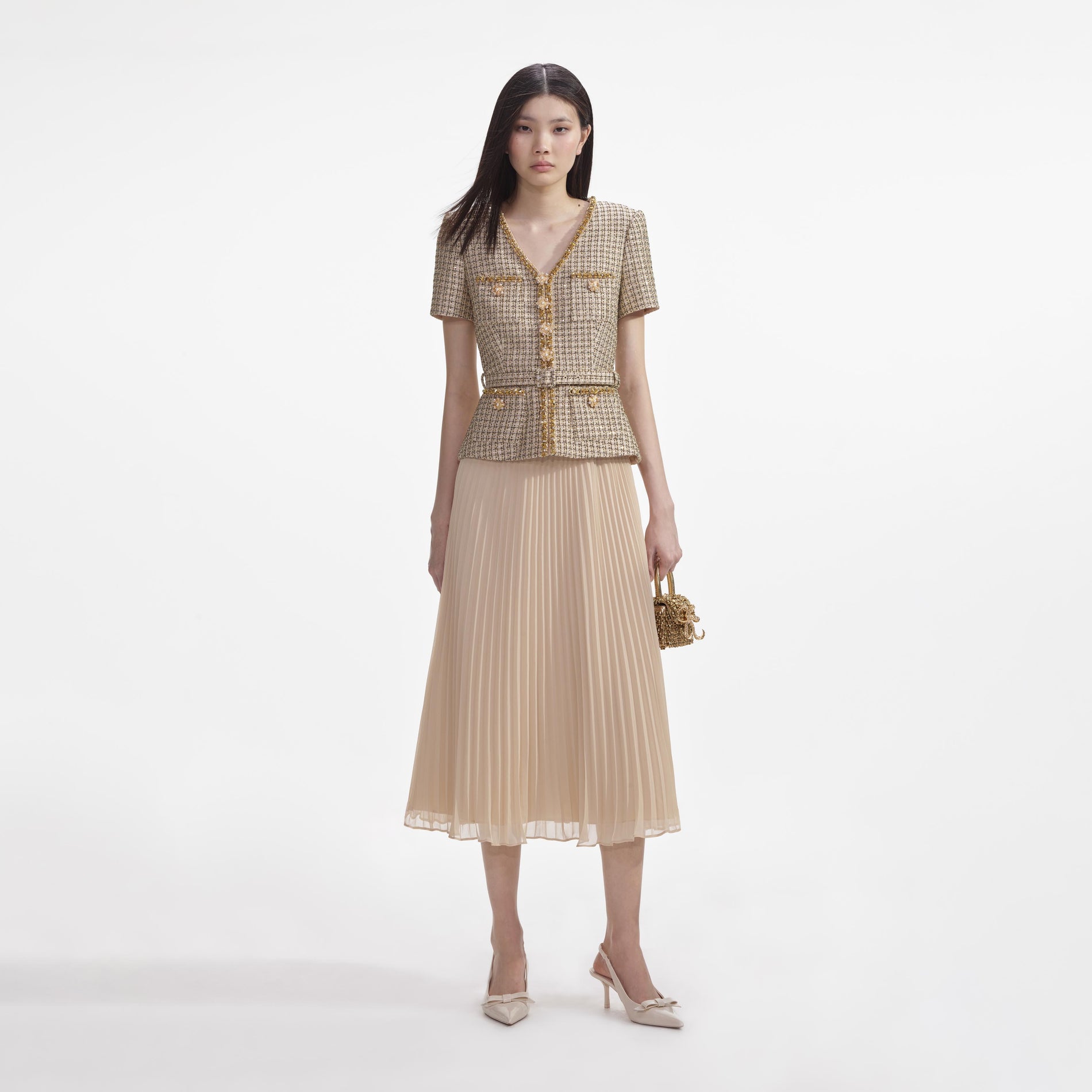 Front view of a woman wearing the Gold Boucle Midi Dress