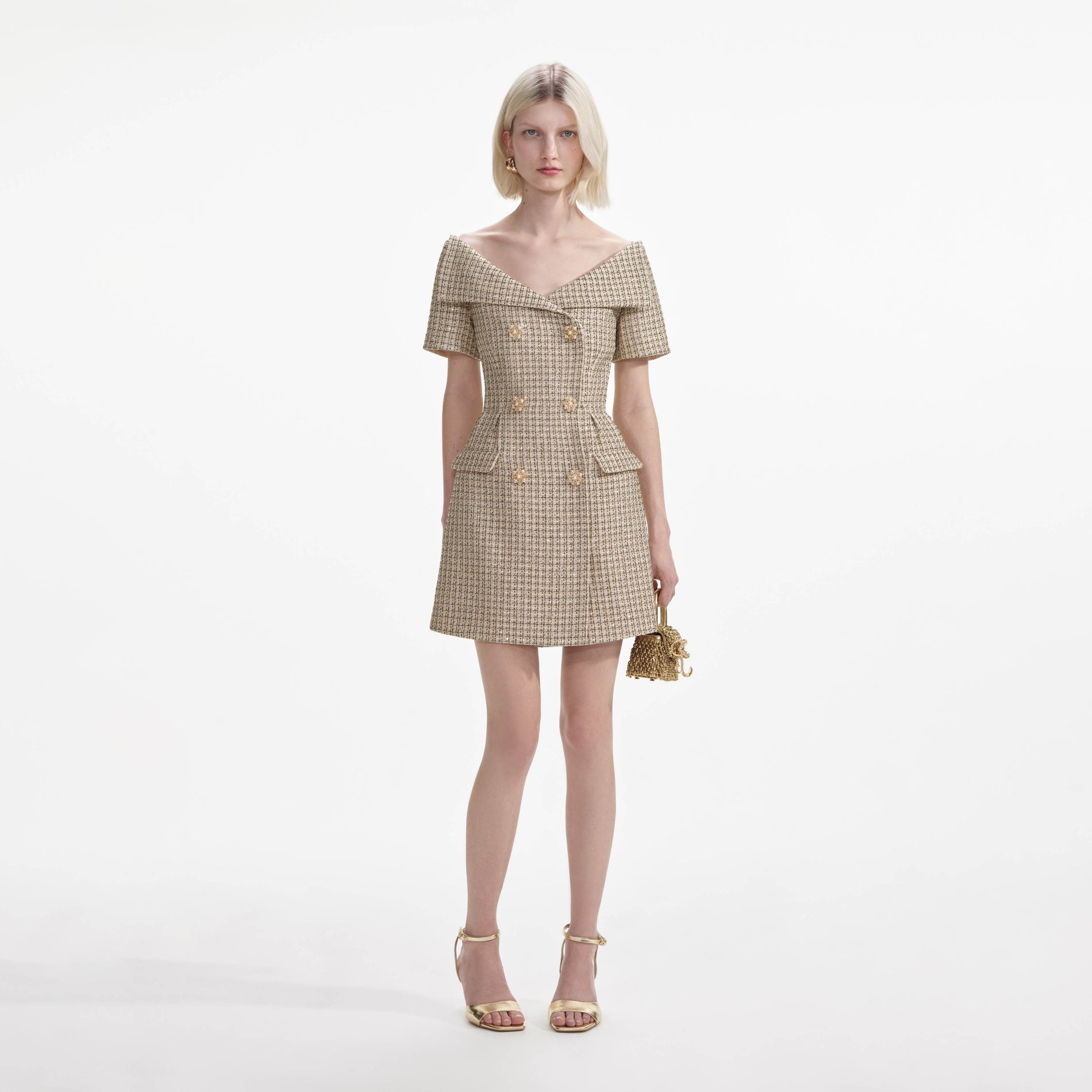 Front view of a woman wearing the Gold Boucle Open Neck Mini Dress