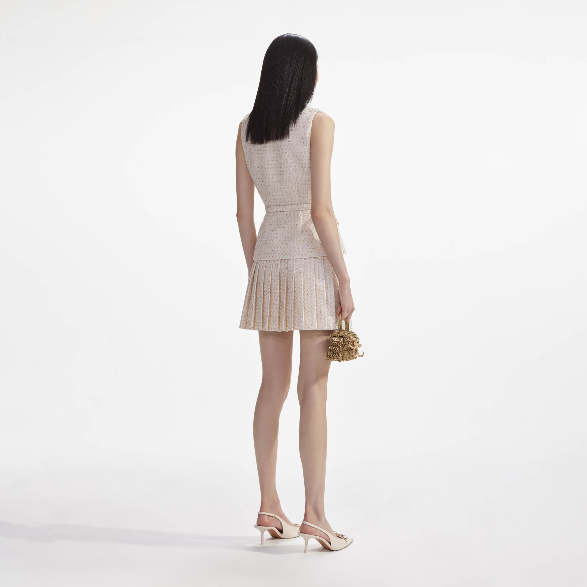 Back view of a woman wearing the Cream Metallic Boucle Tailored Mini Dress