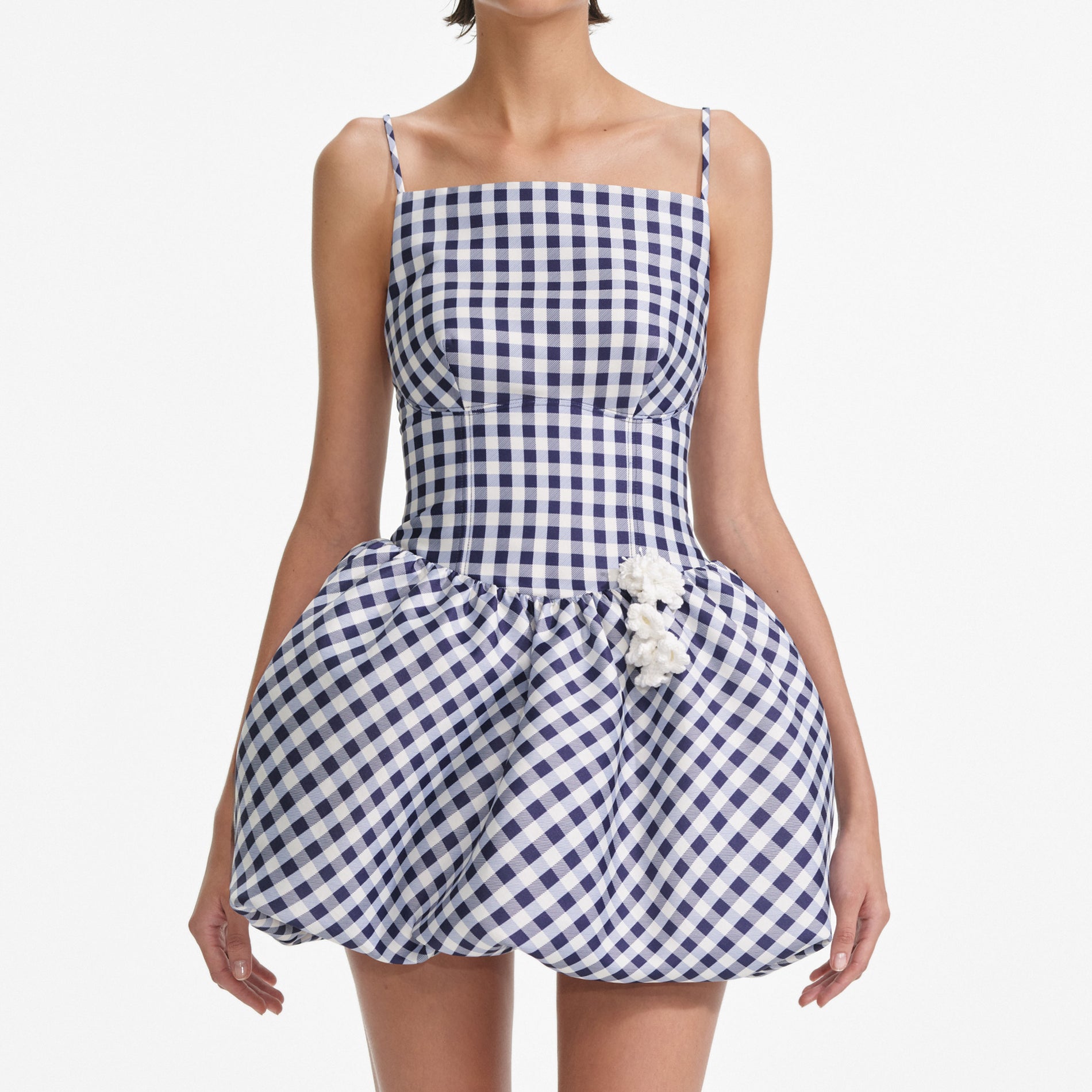 A close up of a woman wearing the Navy Gingham Taffeta Mini Dress
