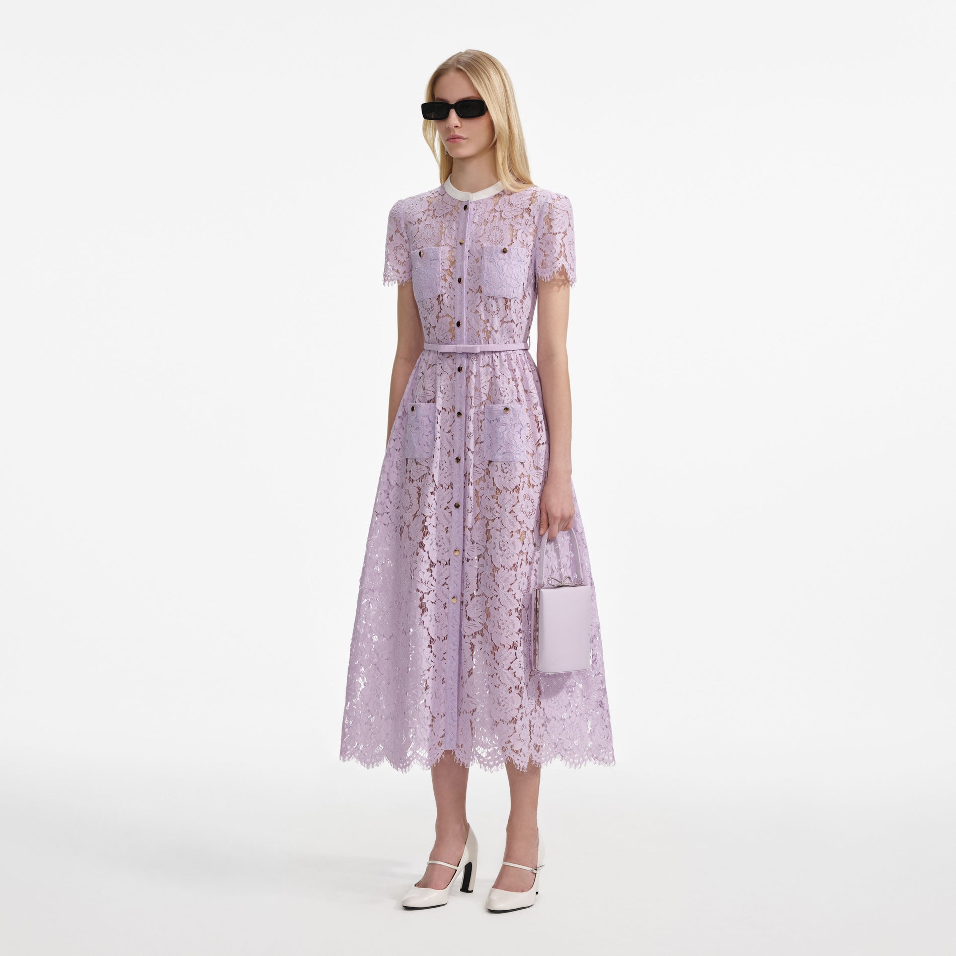 Side view of a woman wearing the Lilac Lace Button Front Midi Dress