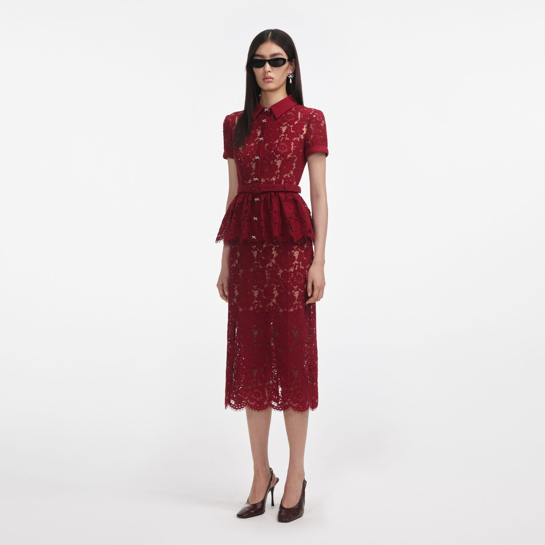 Side view of a woman wearing the Burgundy Lace Peplum Midi Dress