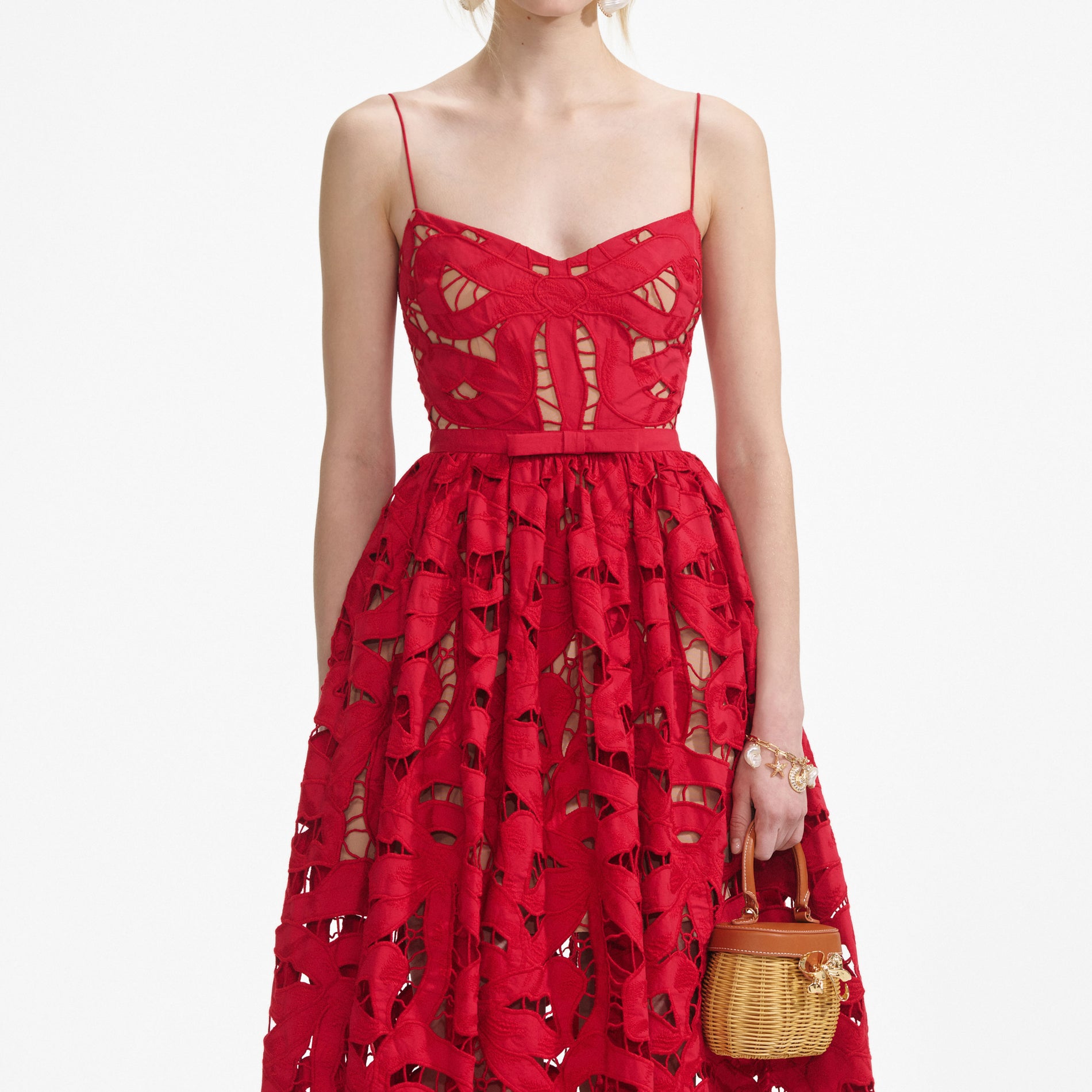 A close up of a woman wearing the Red Bow Embroidered Midi Dress