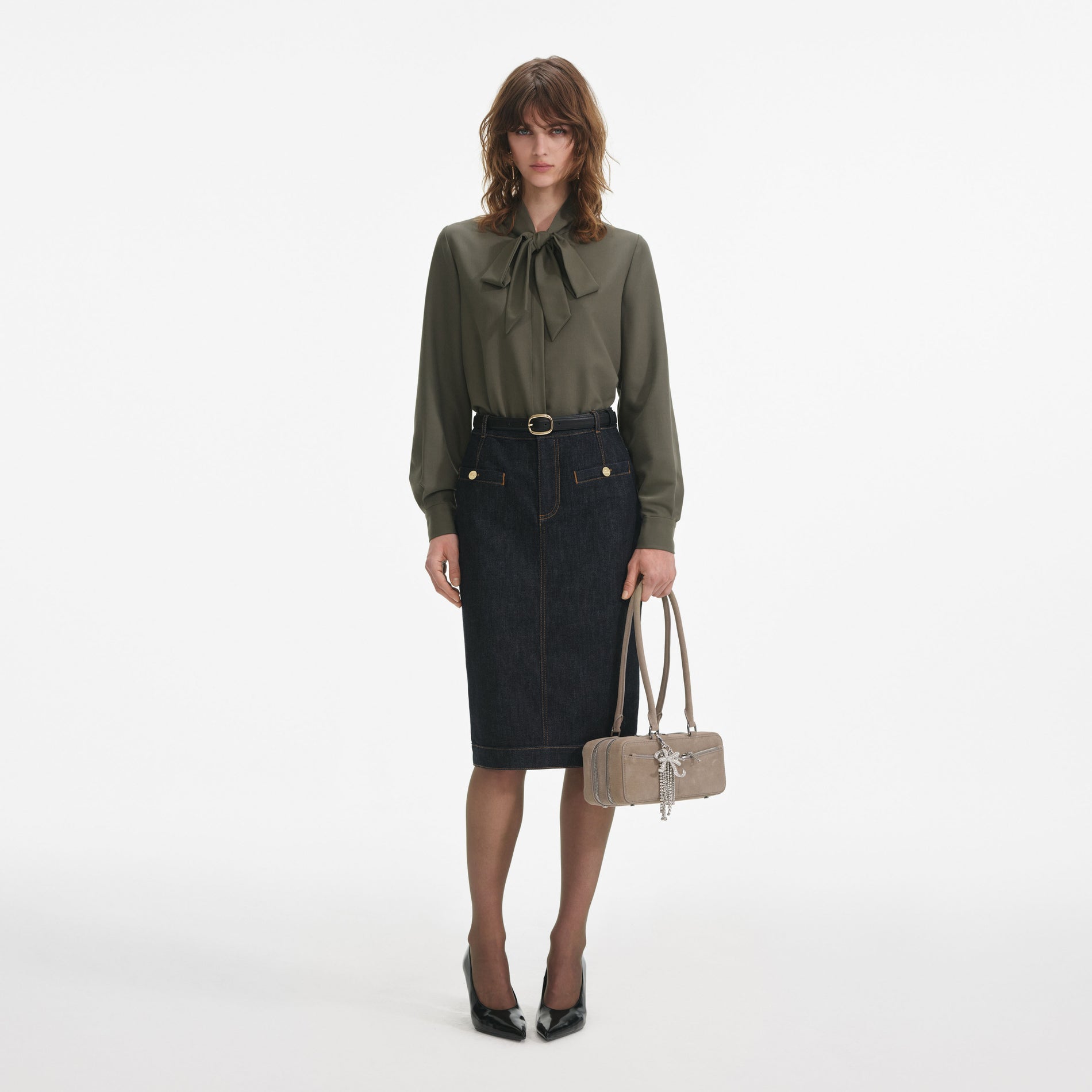 Front view of a woman wearing the Khaki Twill Pussy Bow Blouse