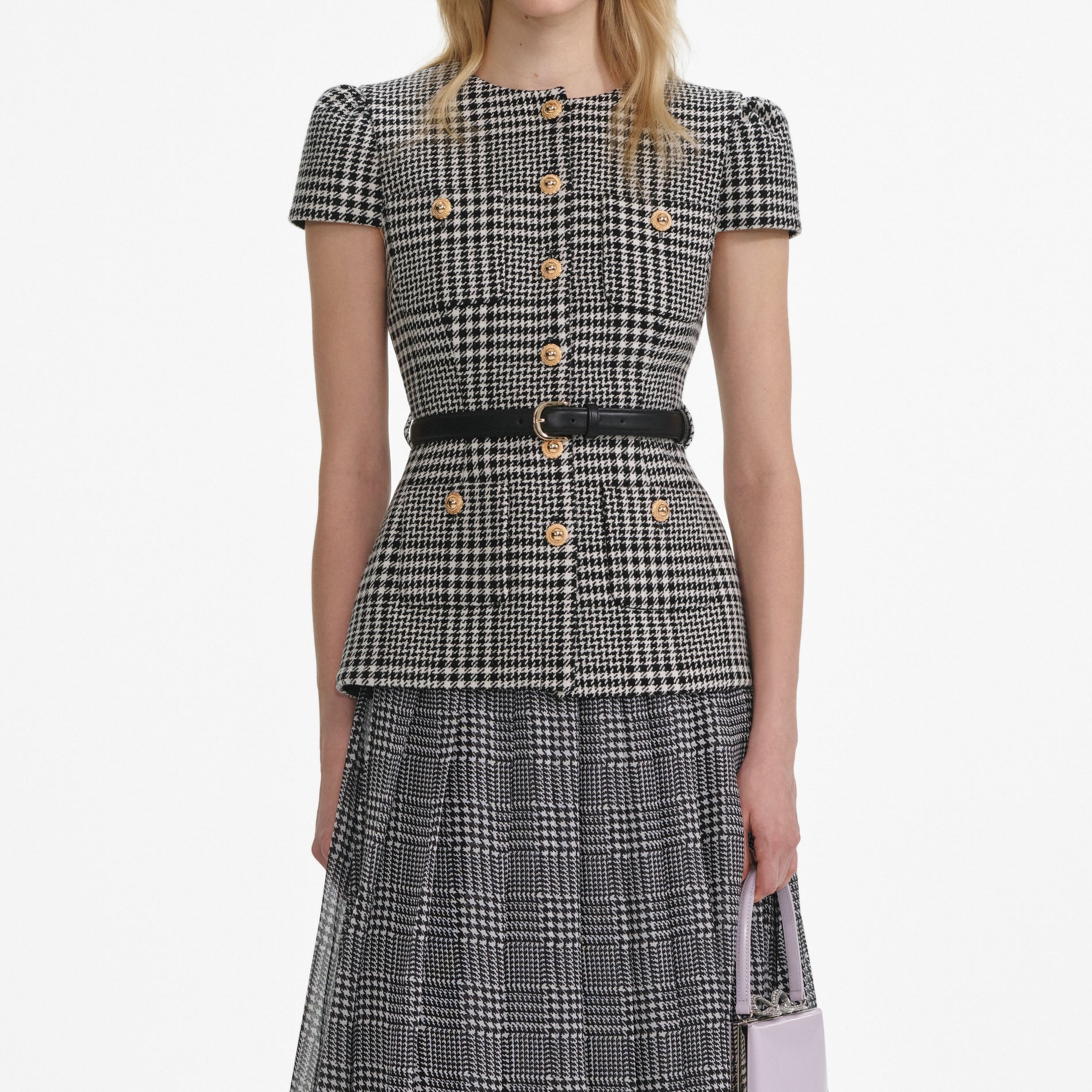 A close up of a woman wearing the Houndstooth Tailored Midi Dress