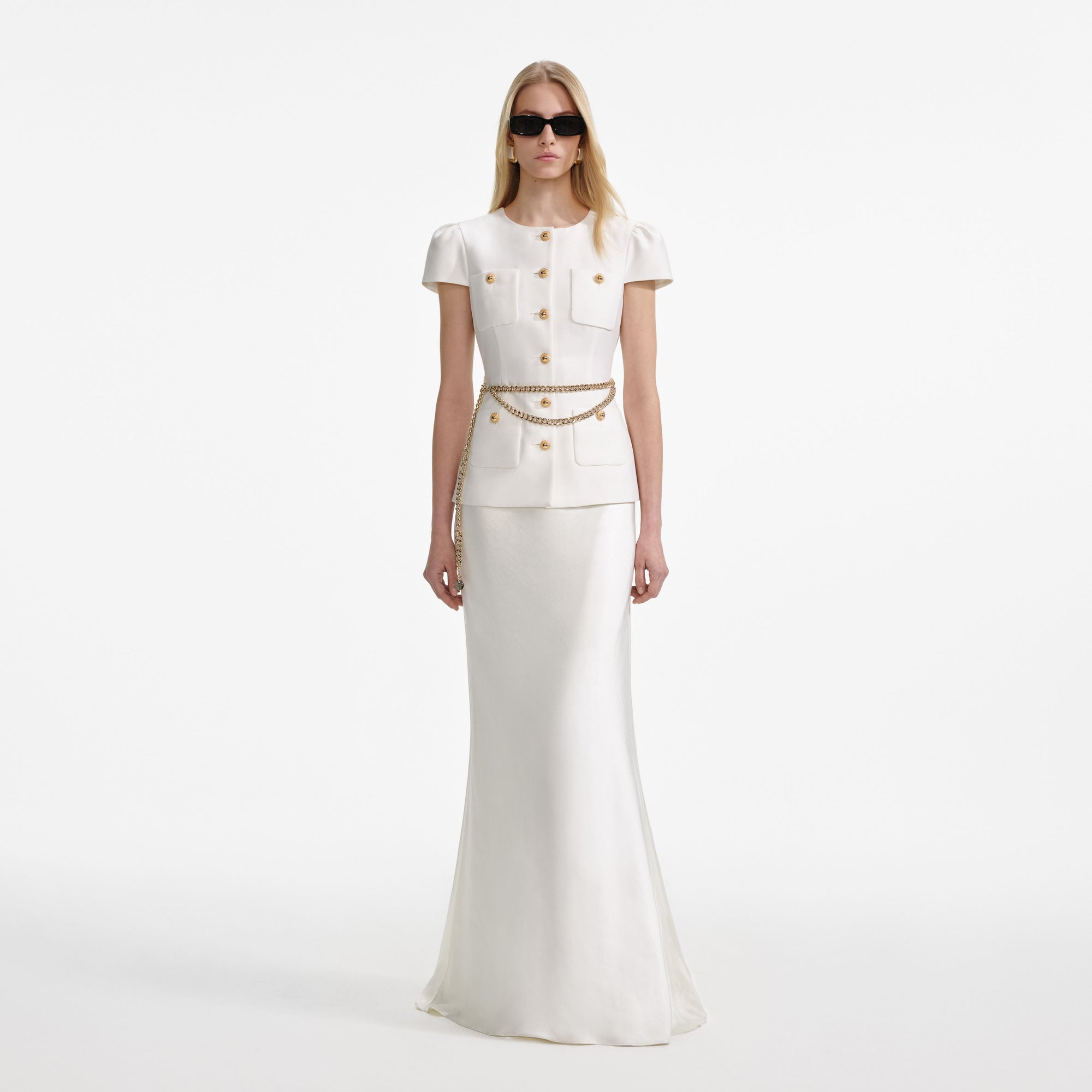 Front view of a woman wearing the Cream Taffeta Chain Belt Maxi Dress