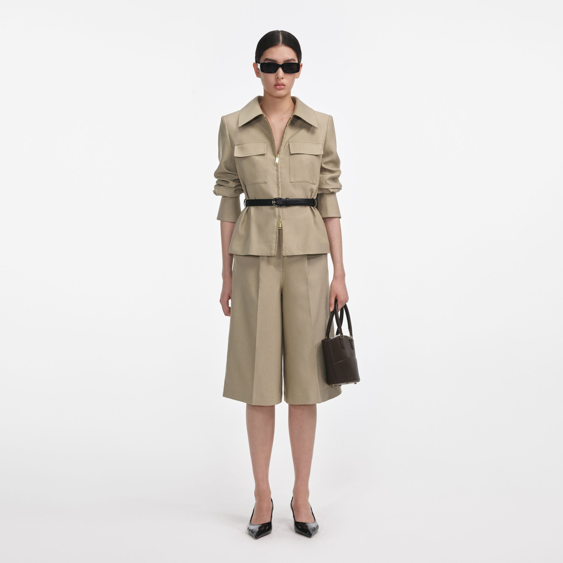 Front view of a woman wearing the Beige Twill Playsuit