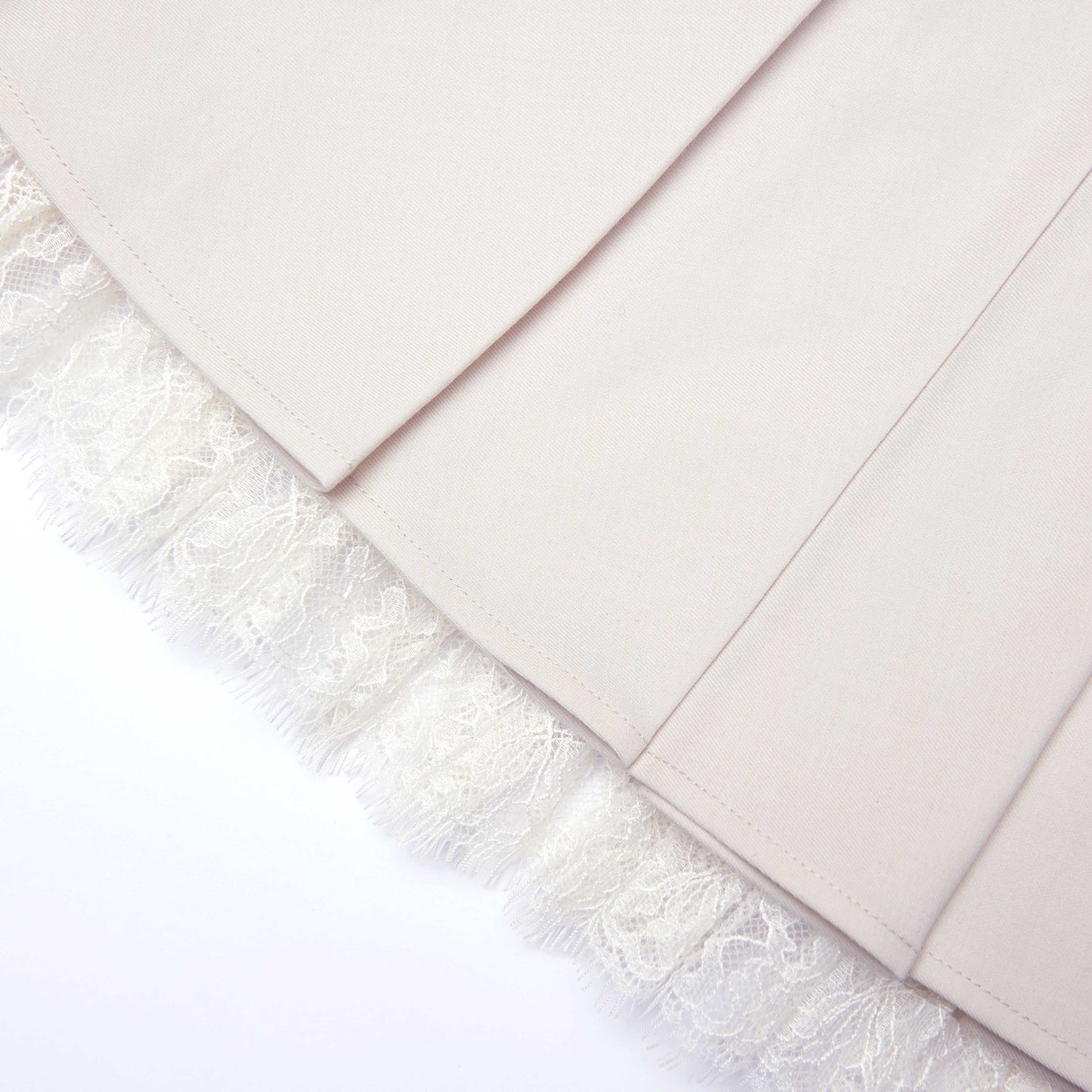 A close up of the fabric for the Cream Twill Pleated Mini Skirt