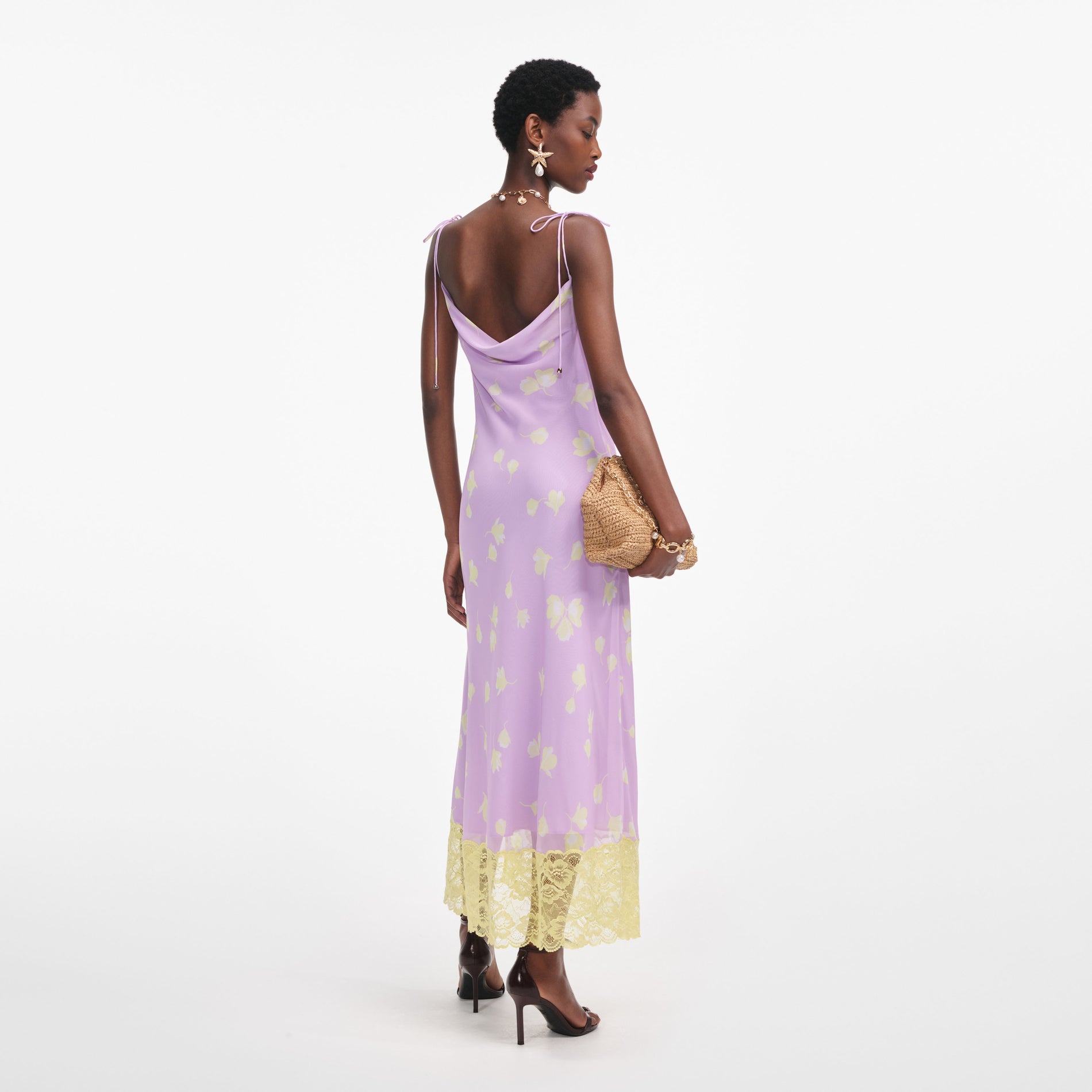 Back view of a woman wearing the Lilac Floral Chiffon Midi Dress