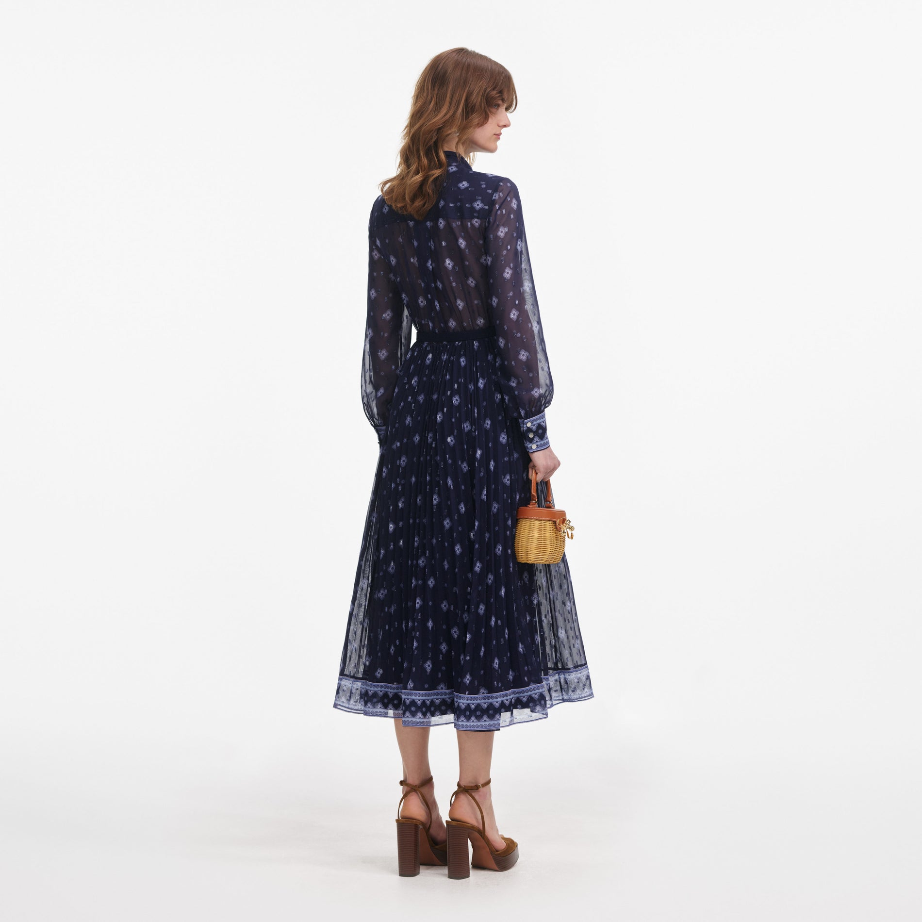 Back view of a woman wearing the Navy Printed Chiffon Midi Dress