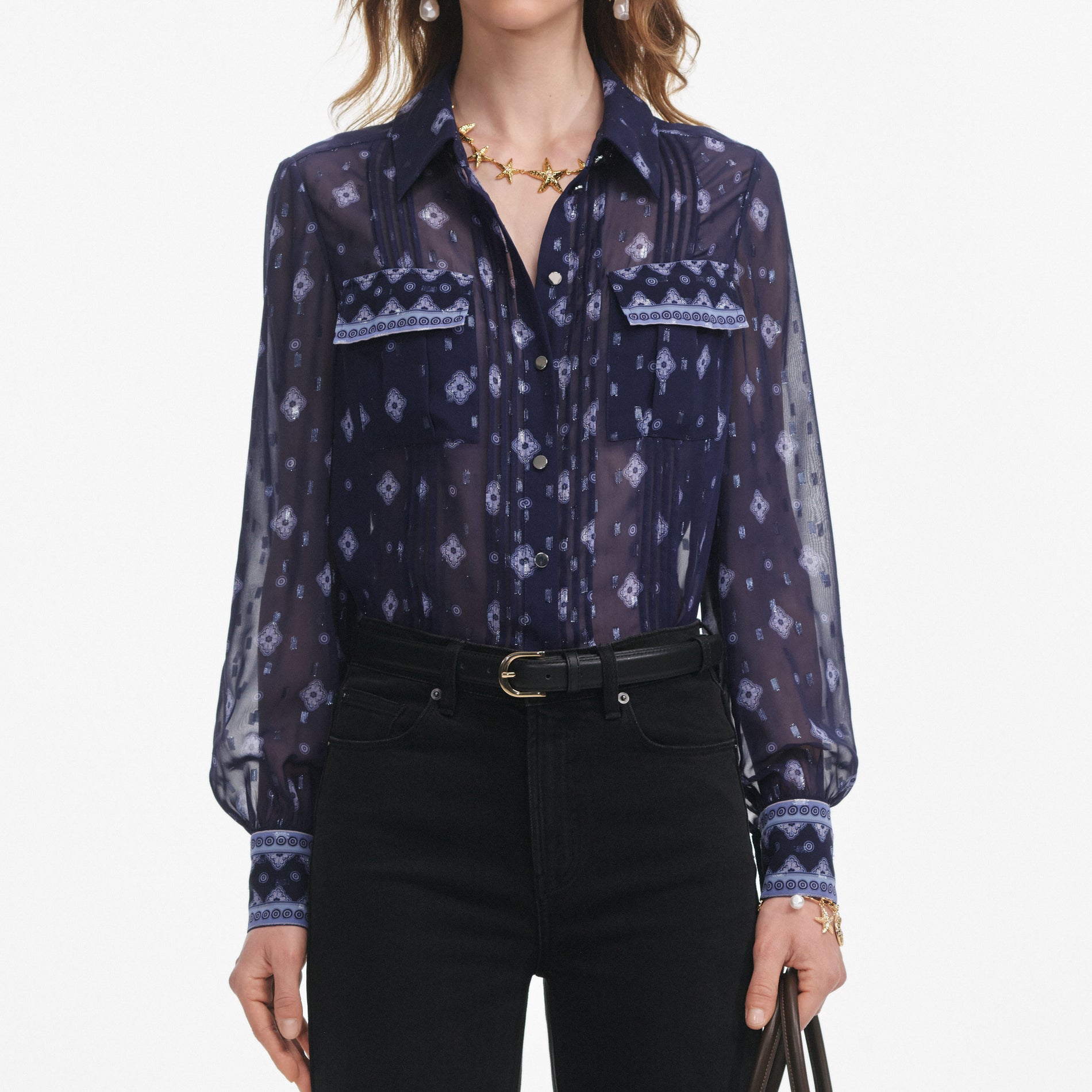 A close up of a woman wearing the Navy Printed Chiffon Blouse