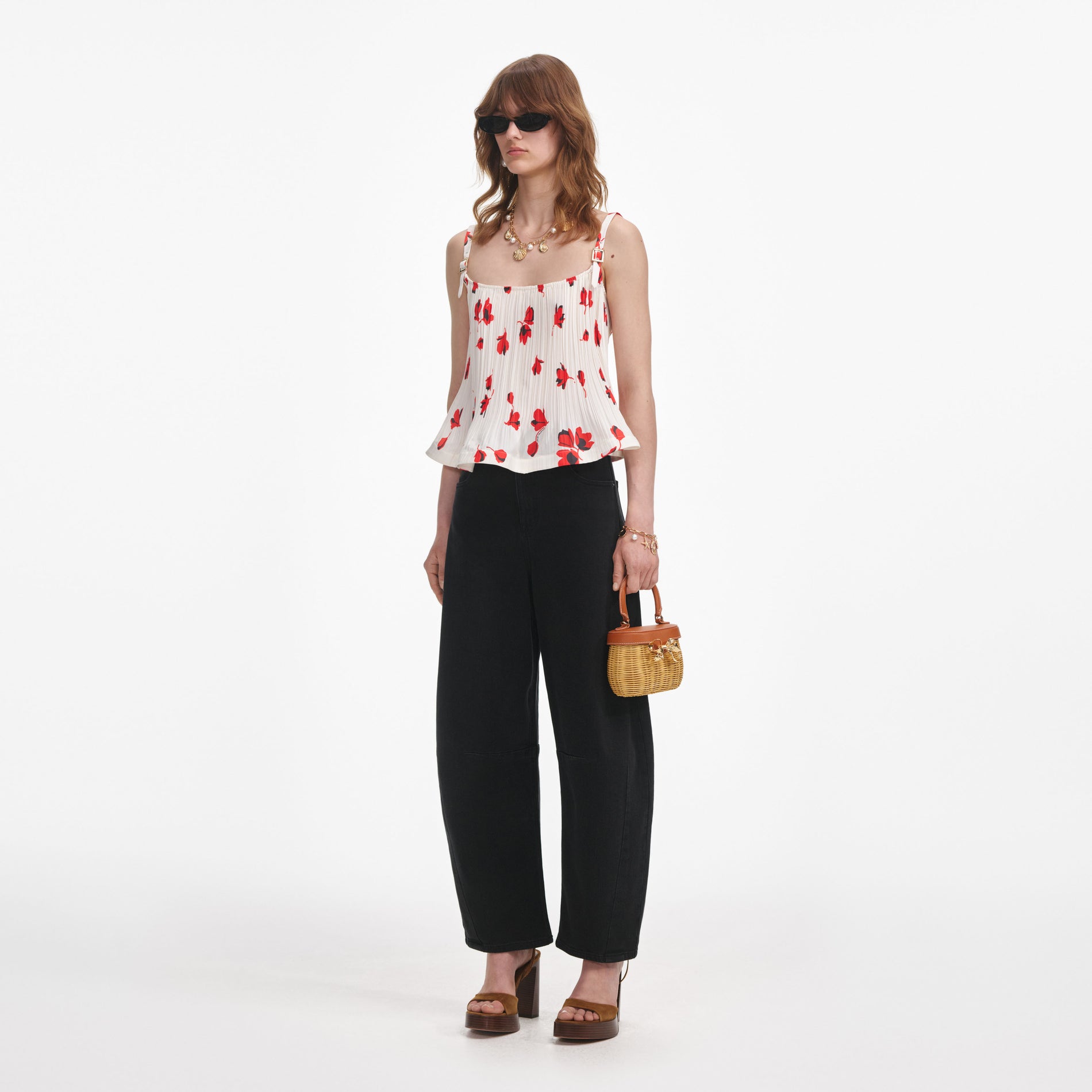 Side view of a woman wearing the White Floral Plisse  Top