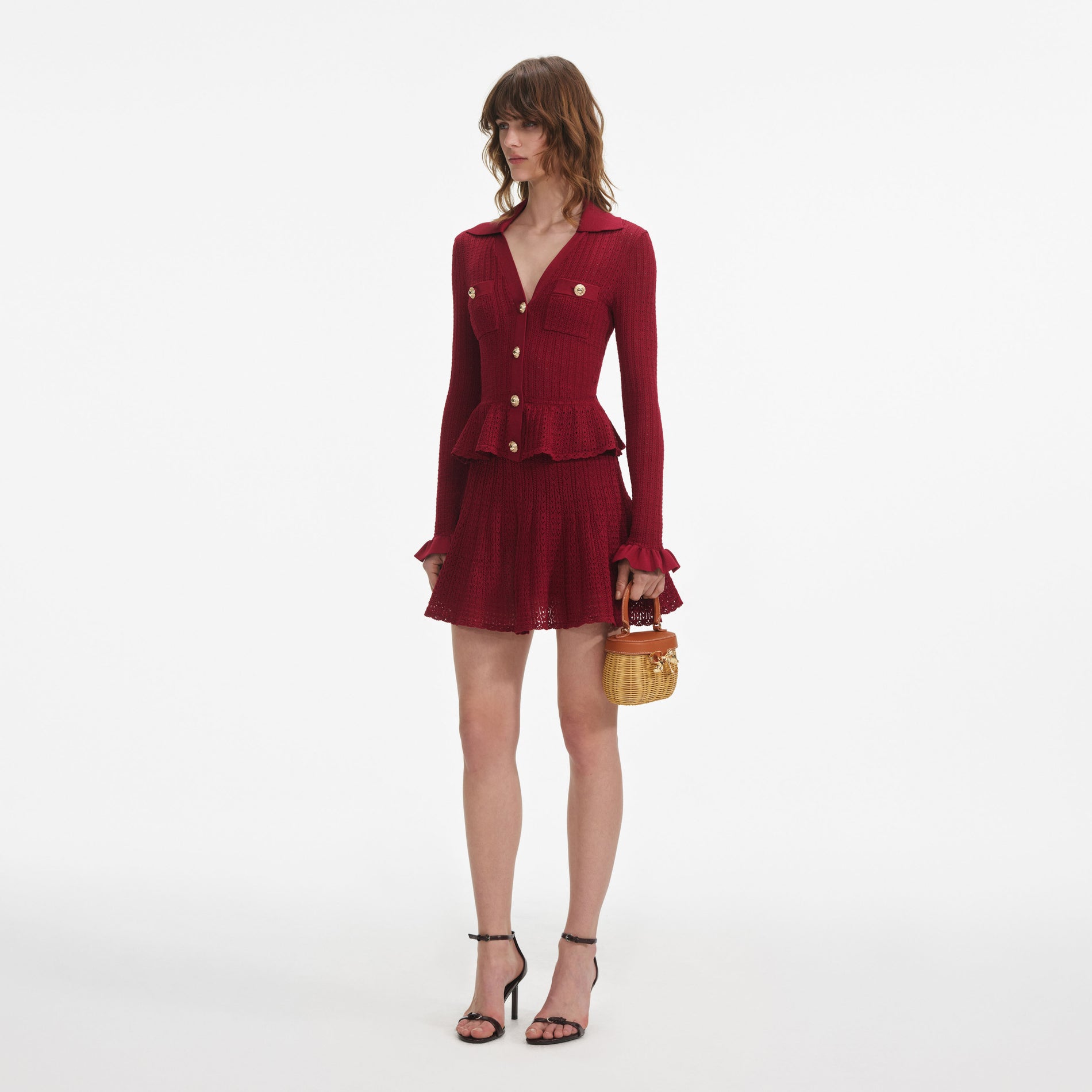Side view of a woman wearing the Burgundy Pointelle Knit Mini Dress