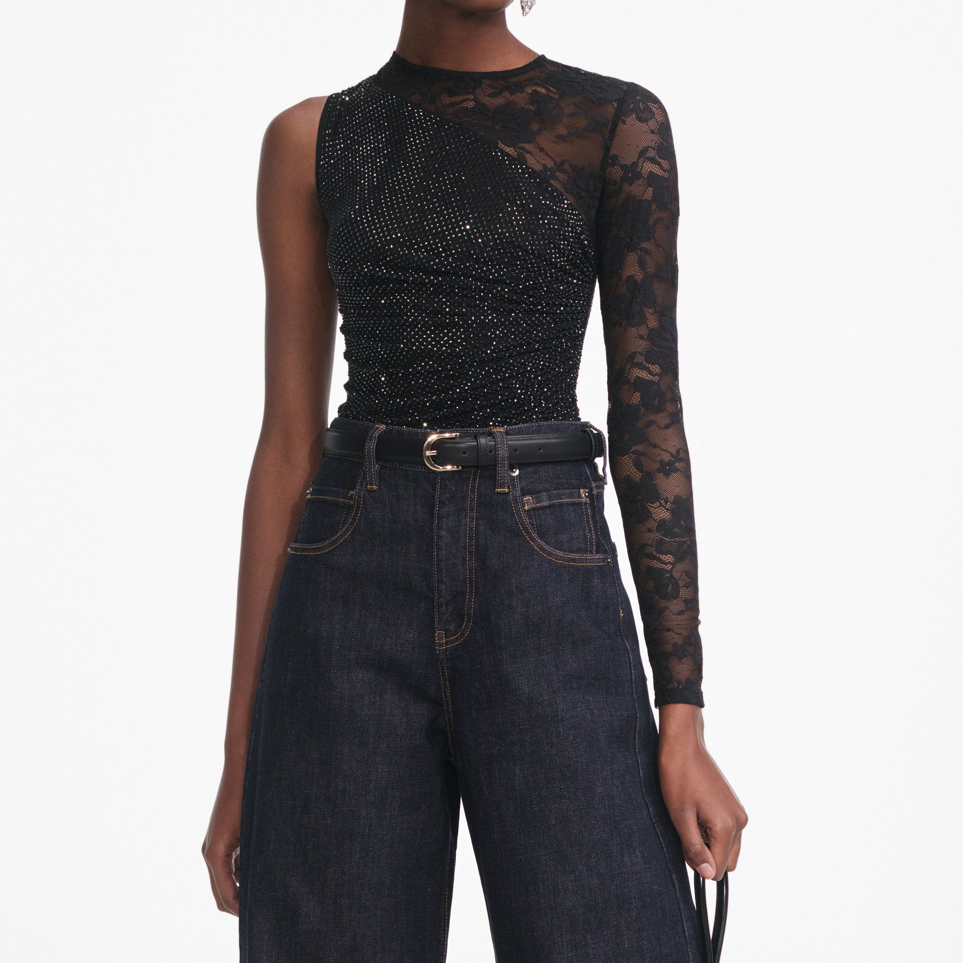 A close up of a woman wearing the Black Rhinestone Lace Sleeve Top