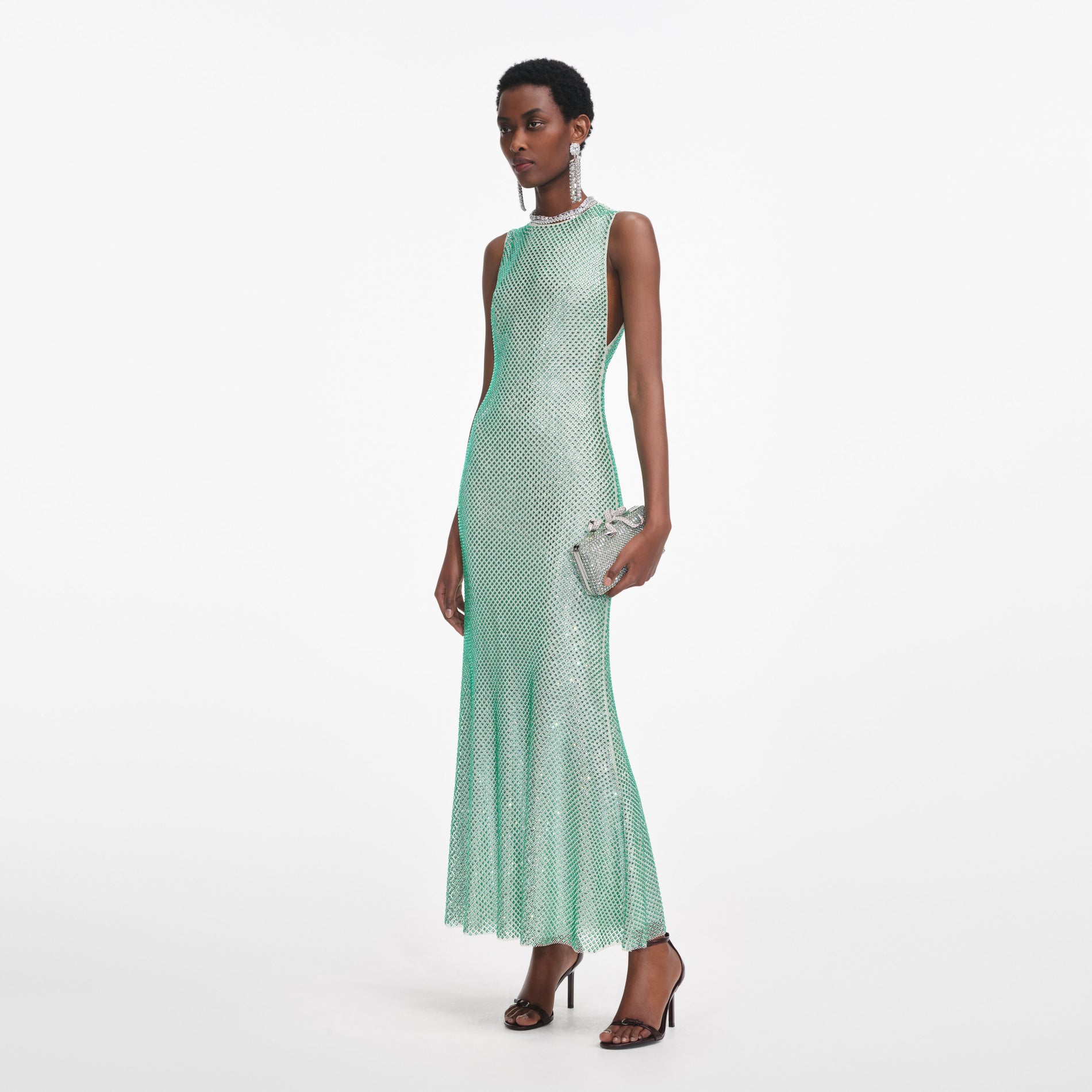 Side view of a woman wearing the Mint Rhinestone Mesh Midi Dress